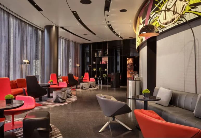 Modern lounge at art'otel London Hoxton for executive networking and corporate breakout sessions.