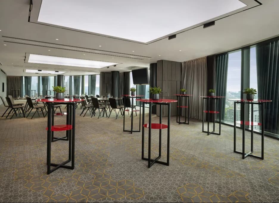 Modern meeting space with floor-to-ceiling windows for corporate receptions and workshops.