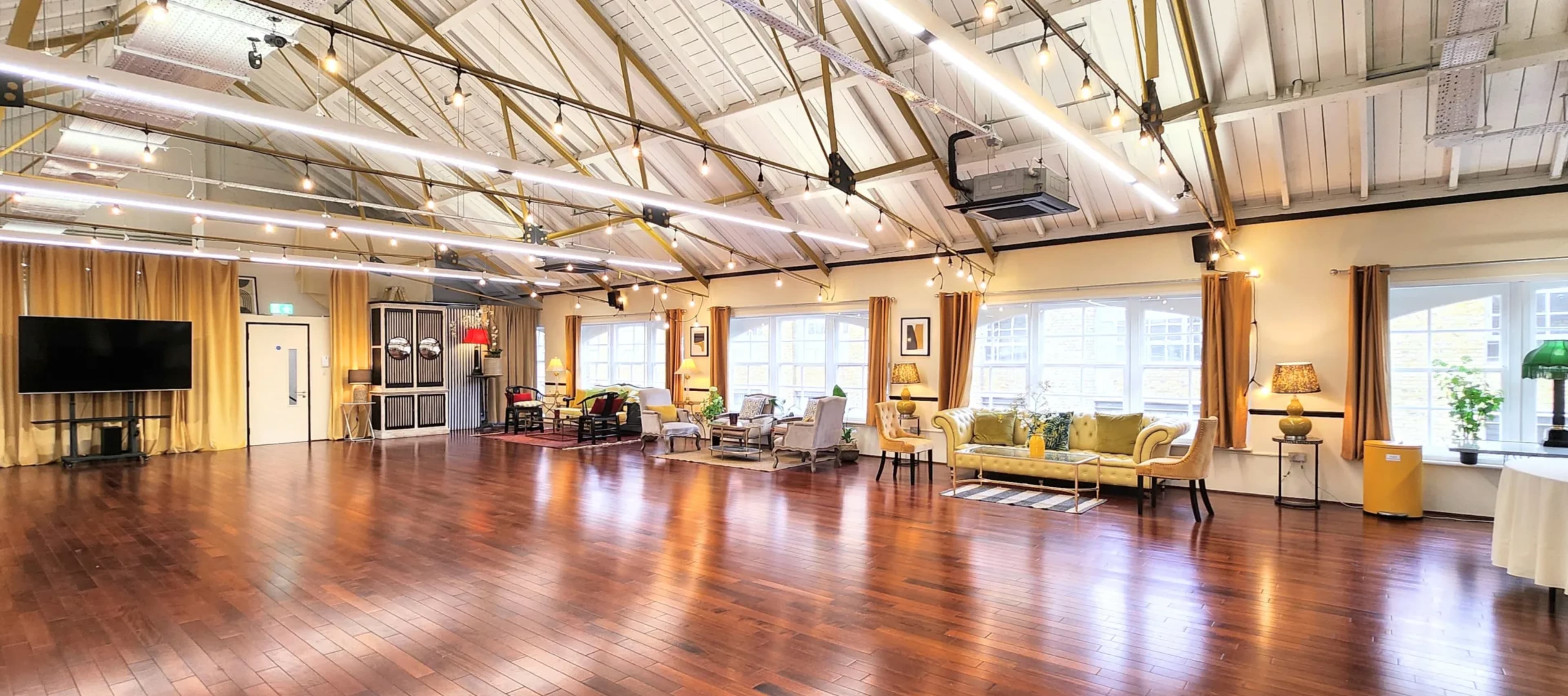 Industrial-chic event space with vaulted ceilings for networking receptions and workshops.