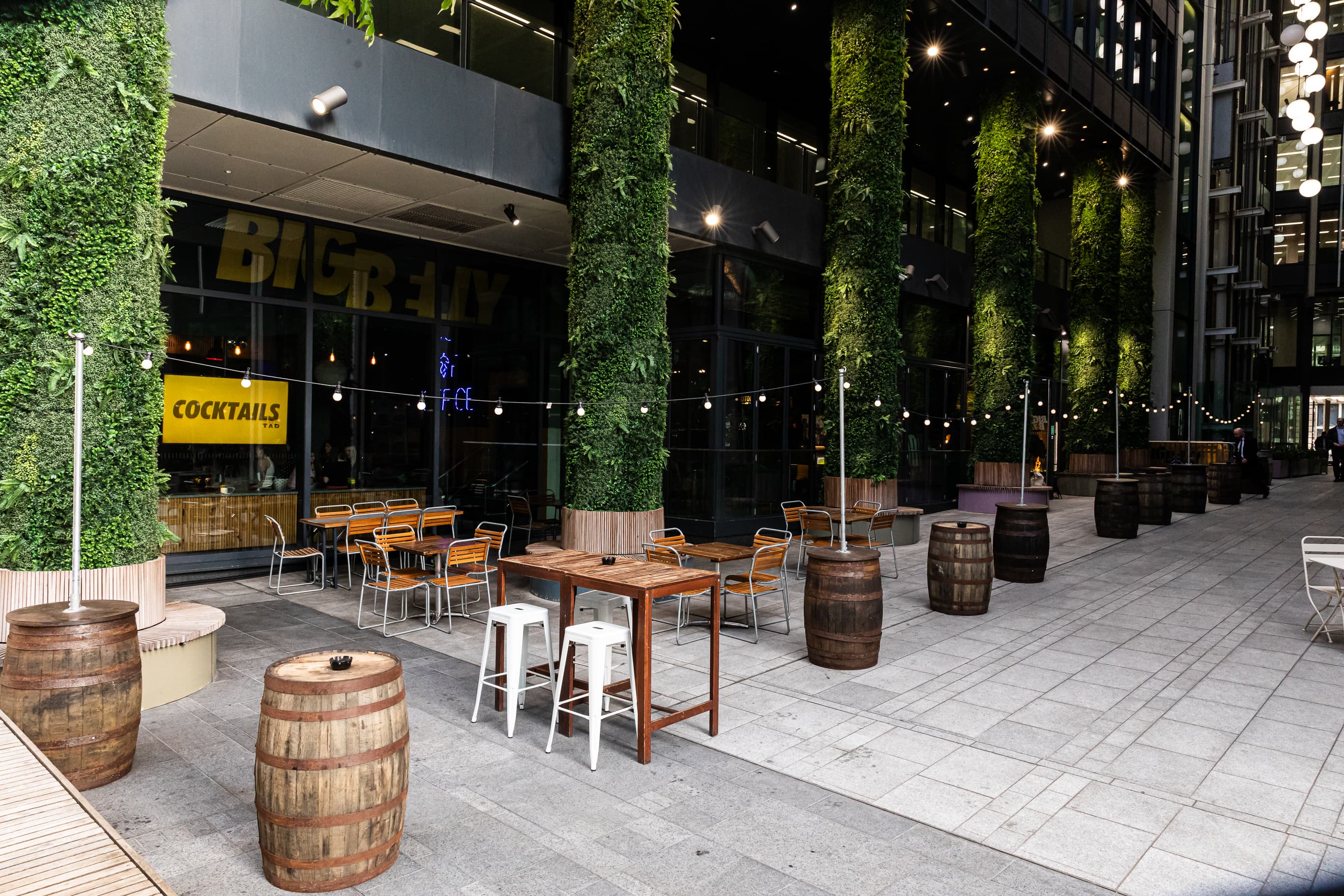 Outdoor terrace with string lighting at Big Belly Comedy Club for networking and cocktail events.