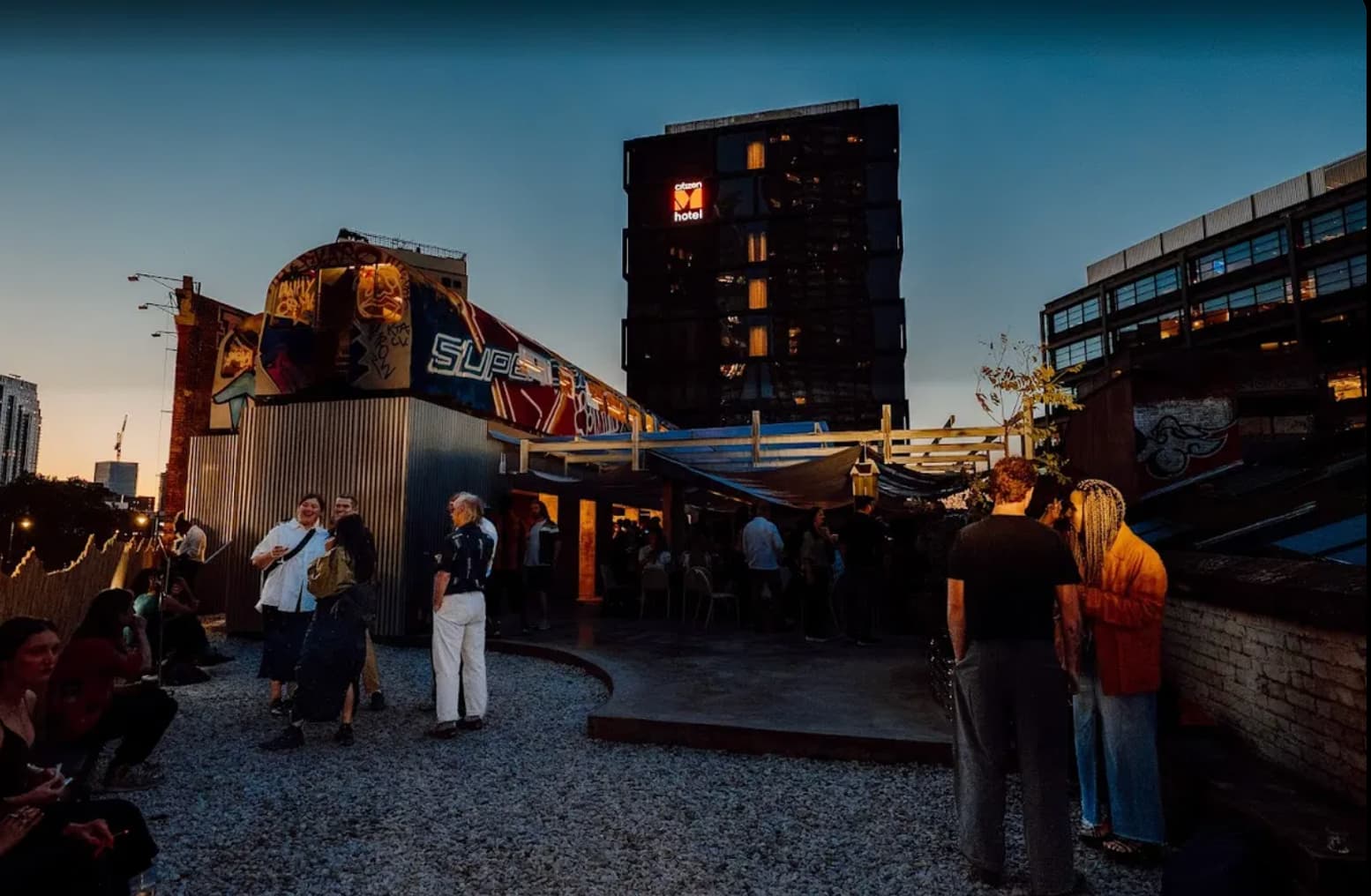 Industrial rooftop reception at Village Underground with atmospheric lighting for networking events.