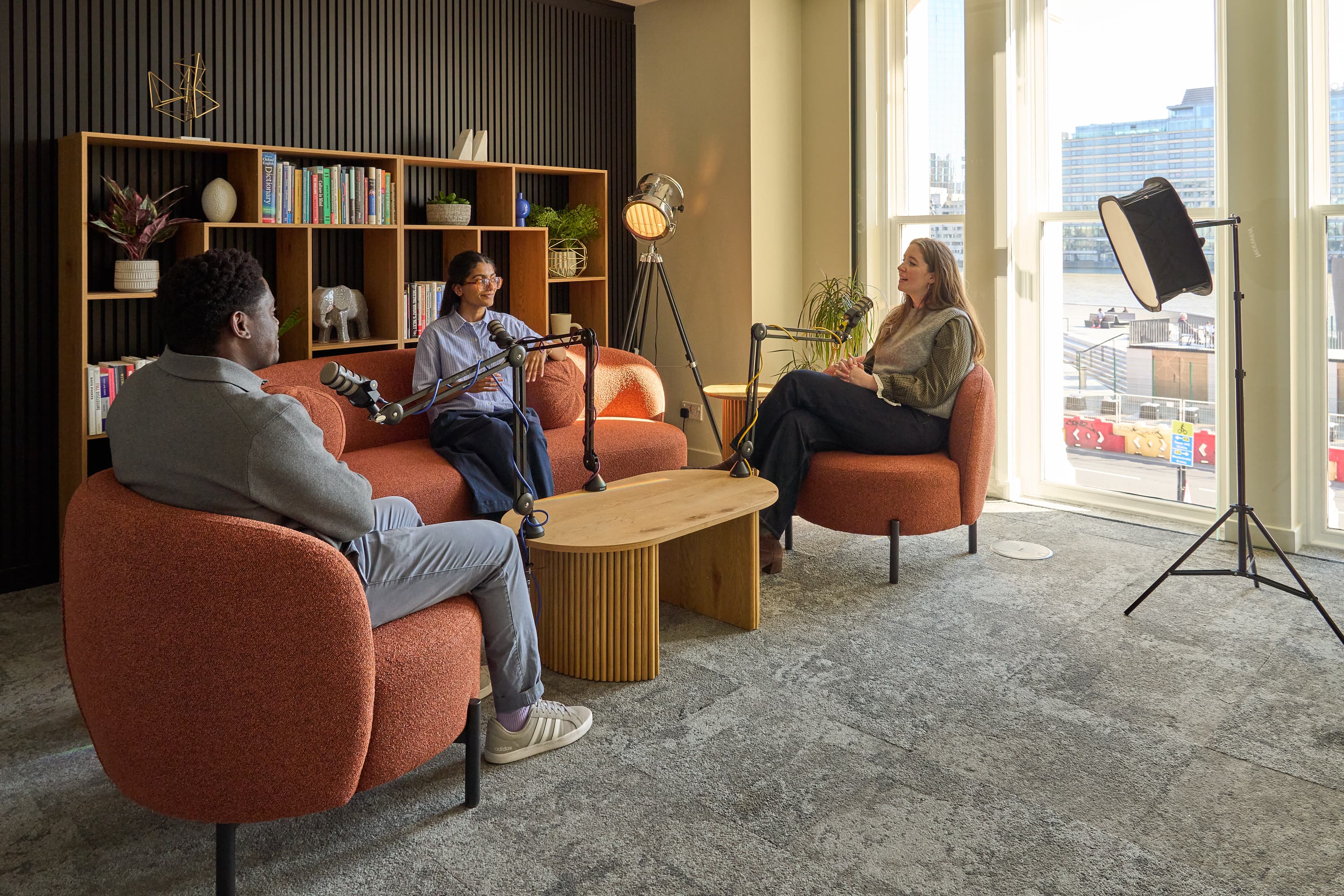 Podcast and fireside chat breakout space with lounge seating for professional event production.