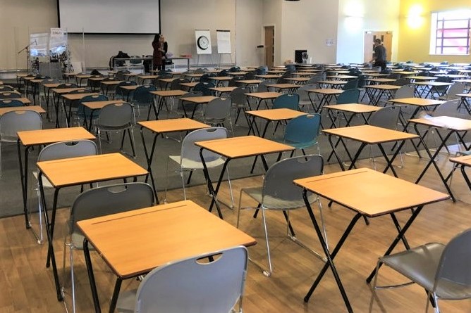 Spacious Wesley Hall meeting room set up for workshops and seminars with folding tables.
