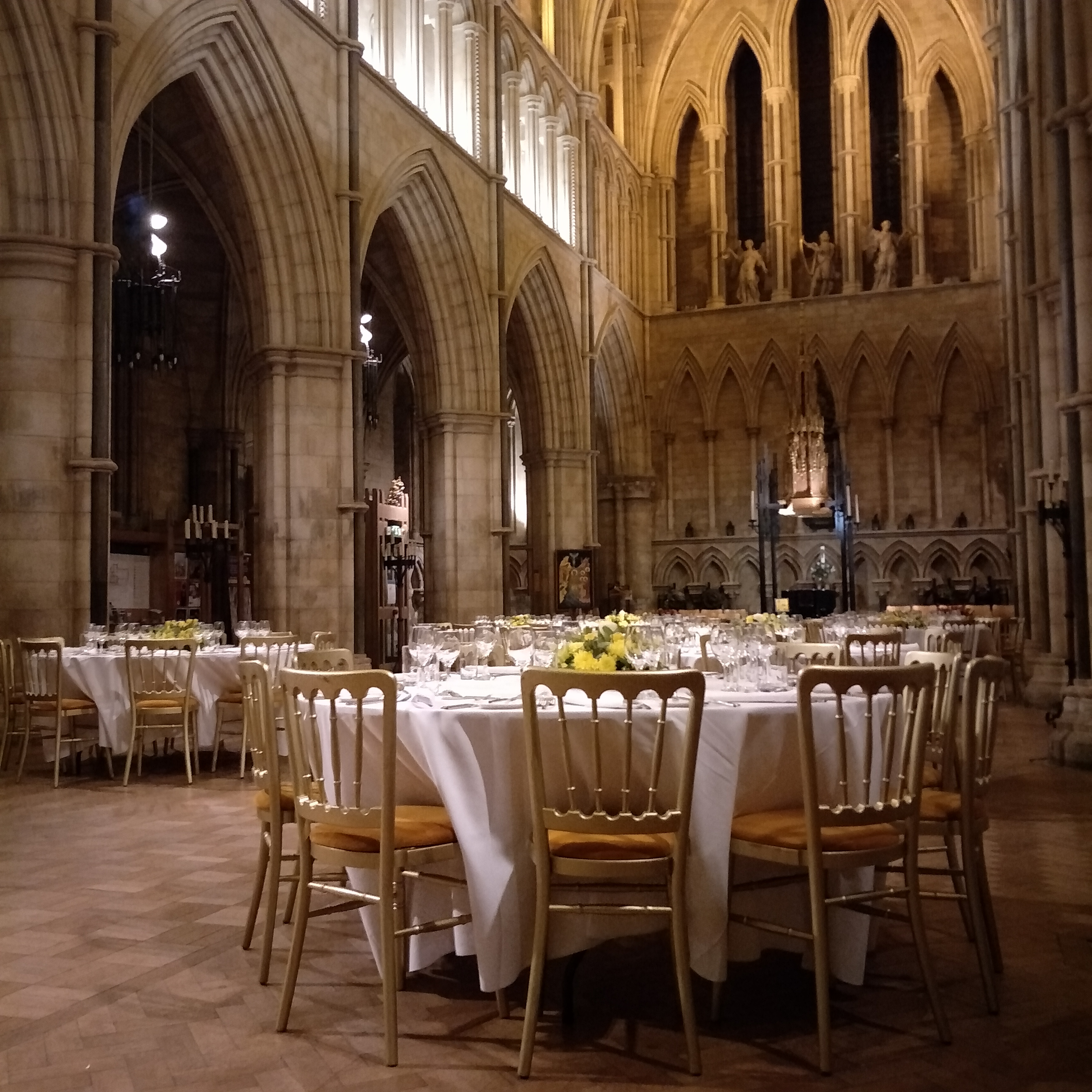 Elegant dining setup in Southwark Cathedral's Nave for upscale events and gatherings.
