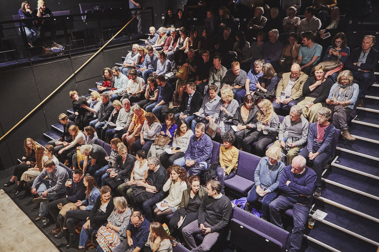 Main House Theatre auditorium with engaged audience, ideal for performances and presentations.