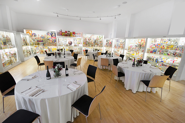 Elegant event space at Museum of Brands with round tables for networking and celebrations.