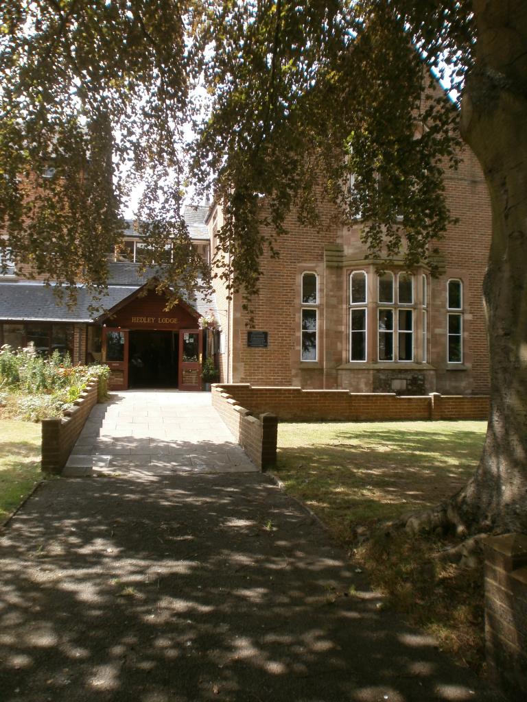 Charming Refectory at Hedley Lodge, perfect for meetings and events with brick architecture.