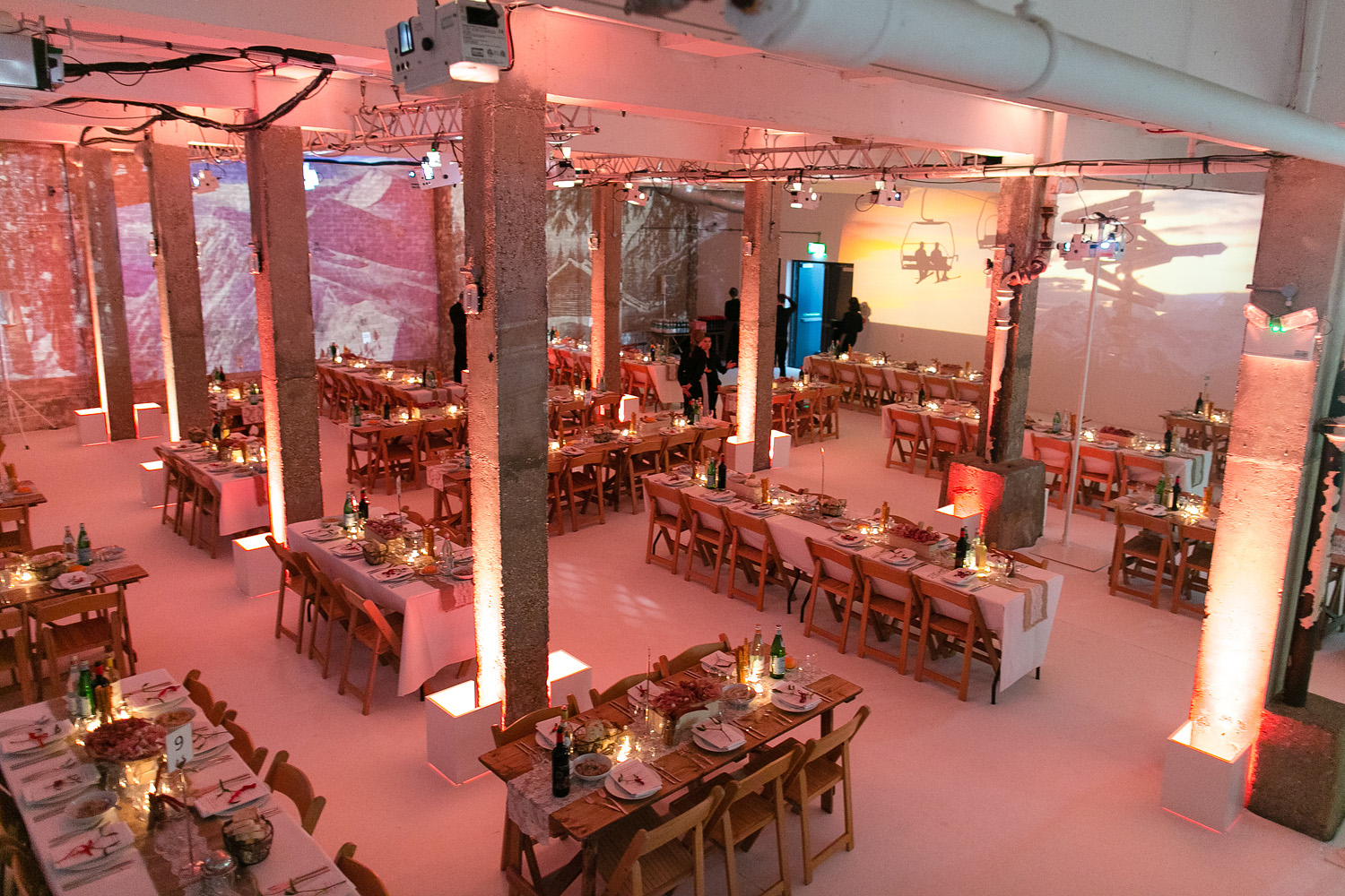 Elegant event space with long tables, ideal for networking and celebrations.