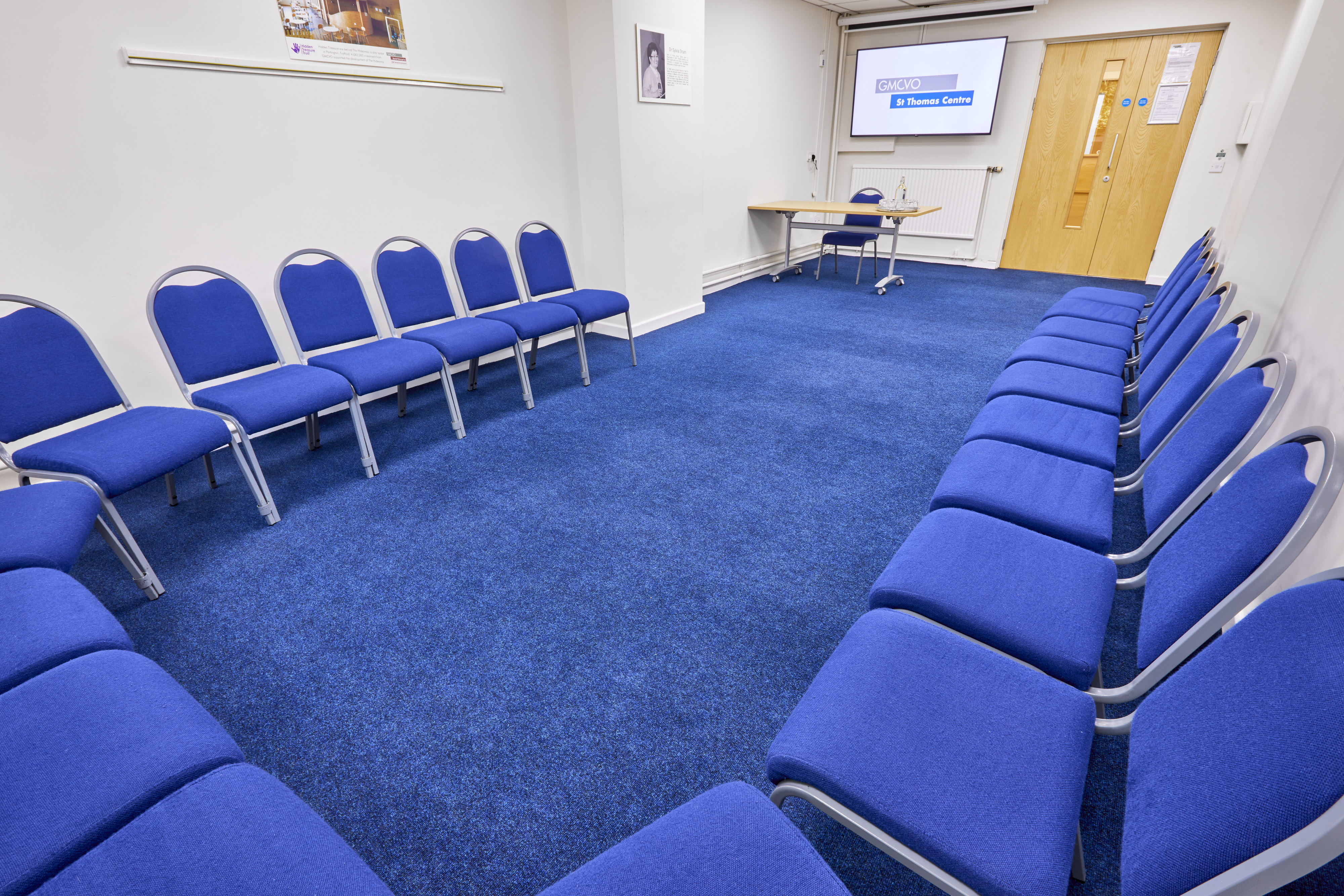 Sham Room in St Thomas Centre: circular blue chairs for workshops and meetings.
