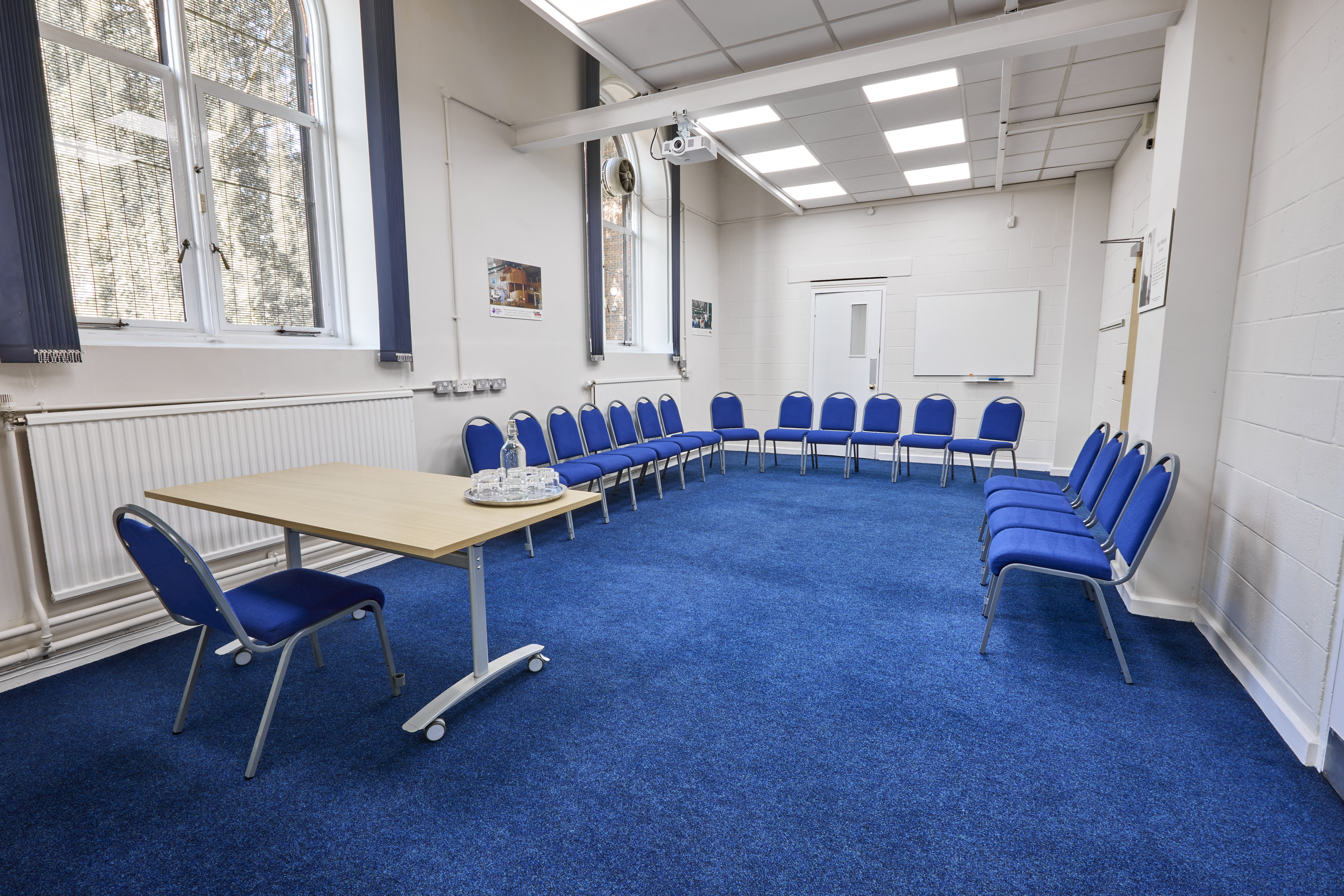 Wilkinson Room at St Thomas Centre: bright meeting space with circular seating for workshops.