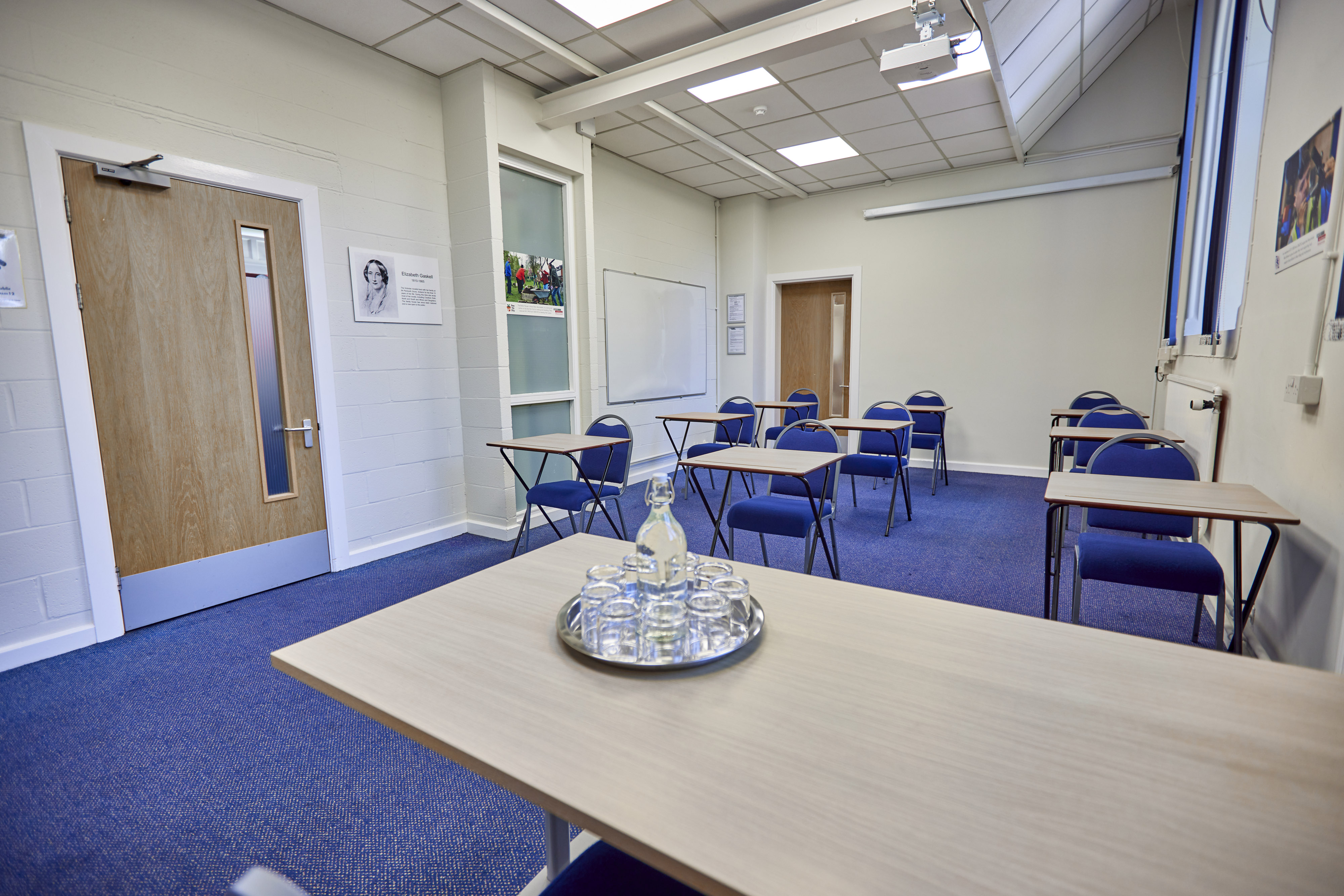 Mambu Room in St Thomas Centre: bright, organized meeting space for workshops and training.