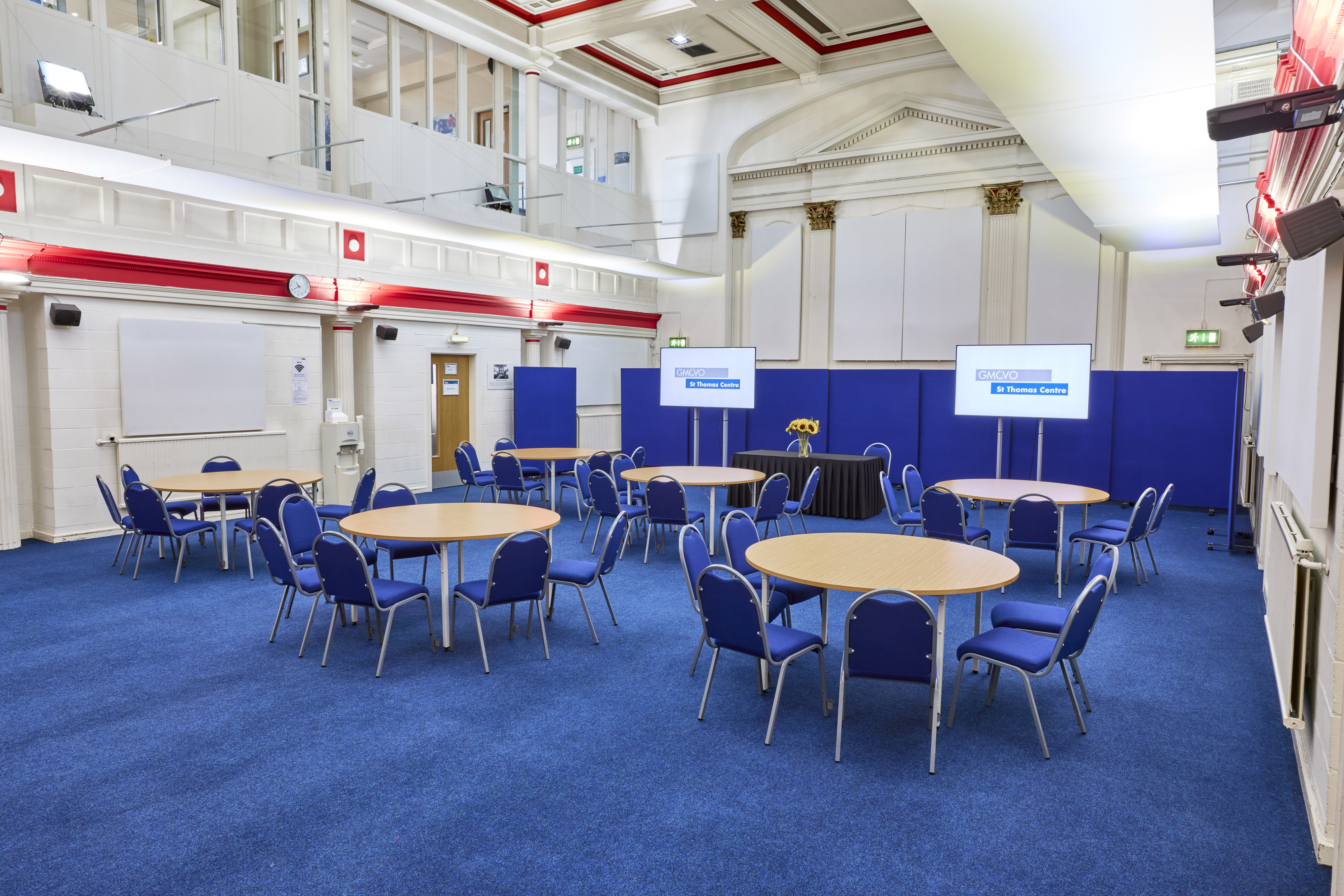 St Thomas Centre meeting space with round tables, ideal for conferences and workshops.