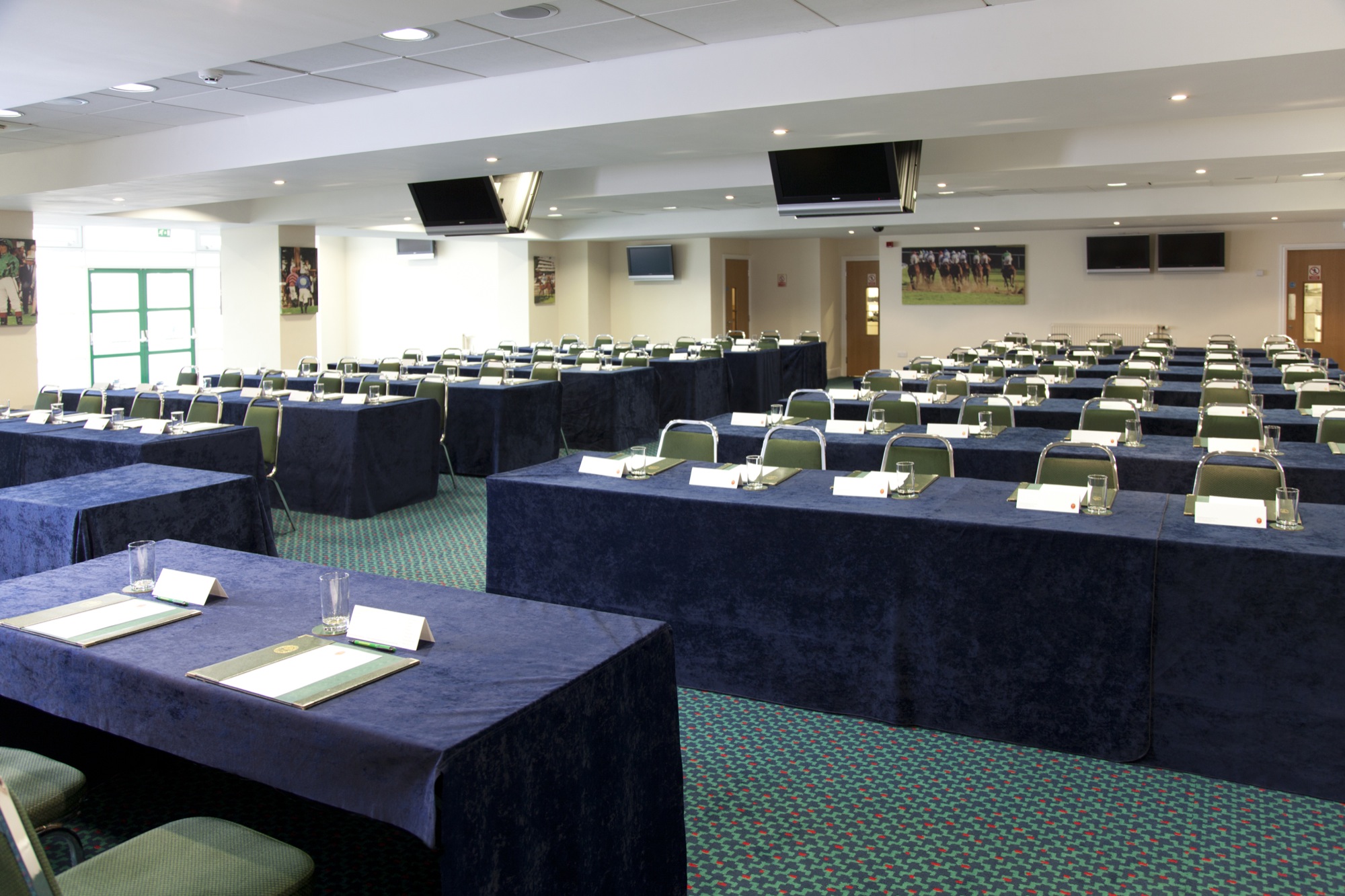 Lancaster Suite at Haydock Park: professional conference room setup with navy tables.
