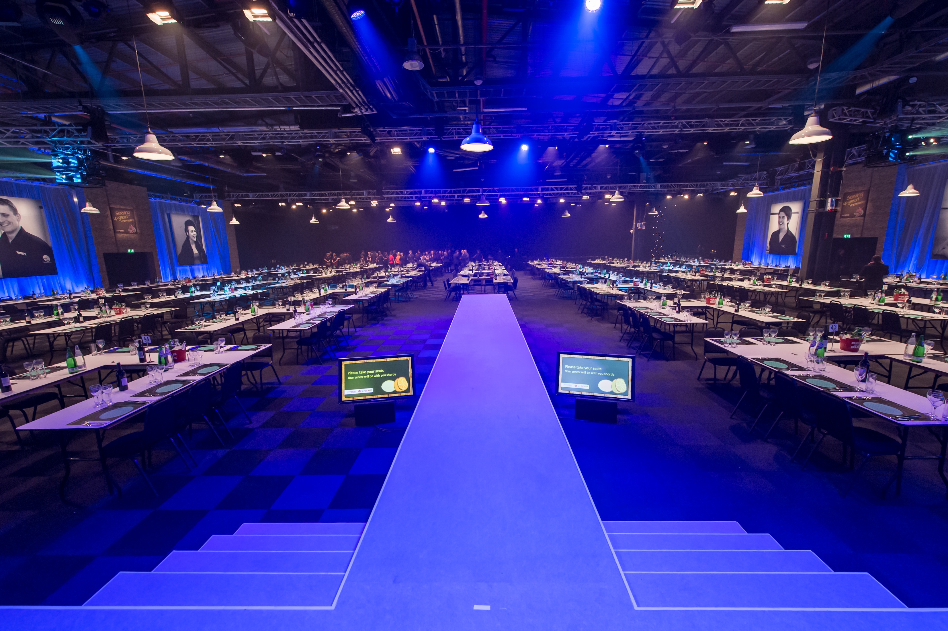Well-organized conference space in Hall 4, EventCity, set for corporate event presentations.