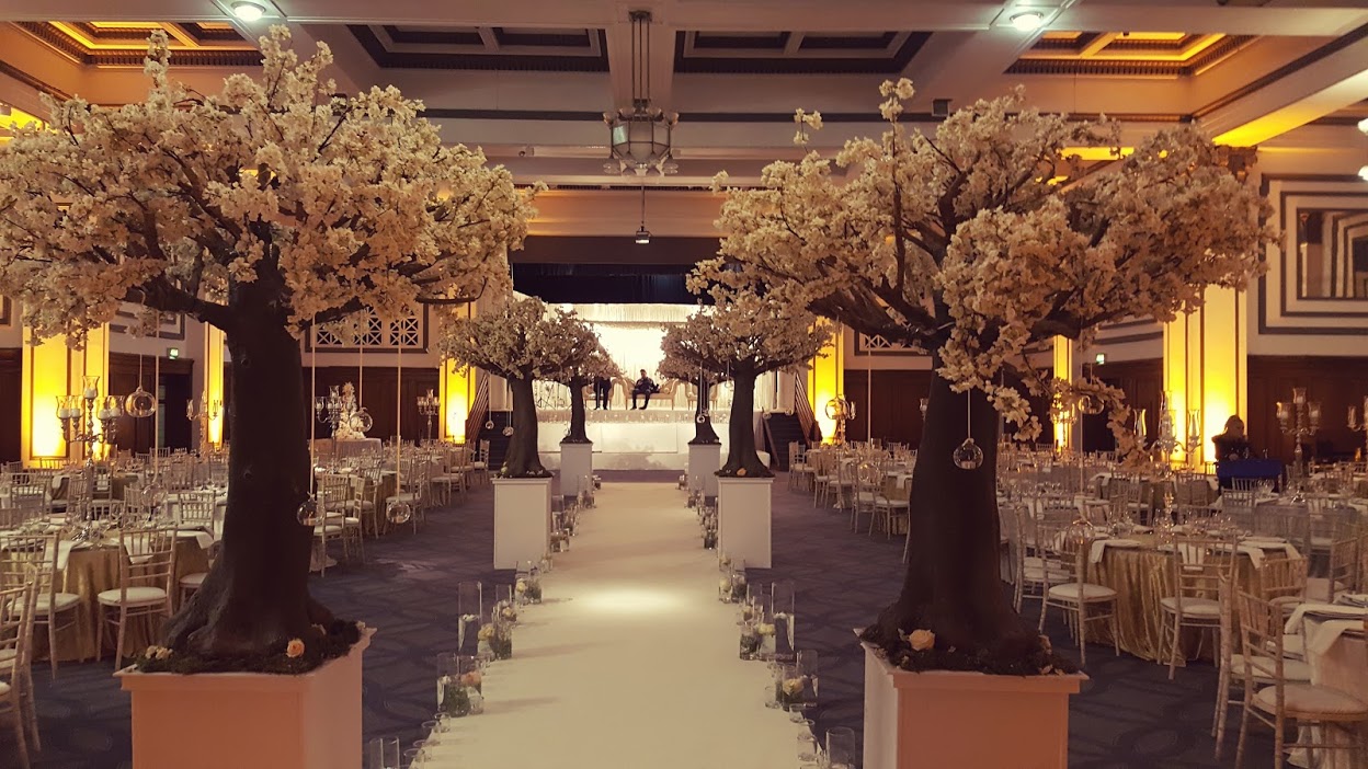 Grand Ballroom at Kimpton Clocktower Hotel with cherry blossom trees for elegant weddings.