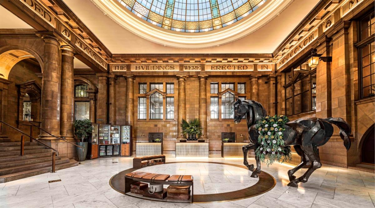 Whitworth Rooms at Kimpton Clocktower Hotel with horse sculpture, ideal for upscale events.