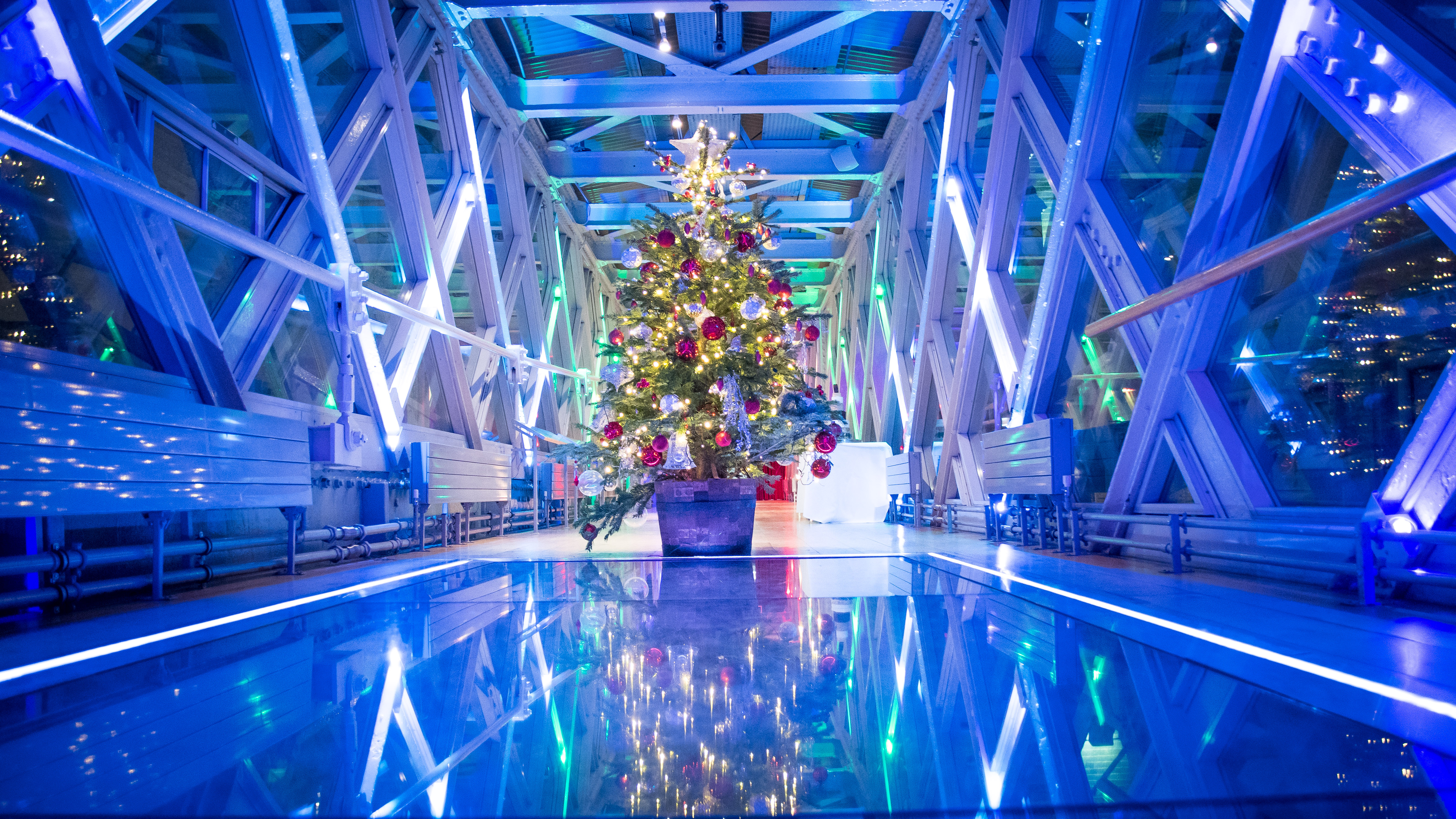 "Tower Bridge Walkways with Christmas tree, ideal for holiday events and gatherings."