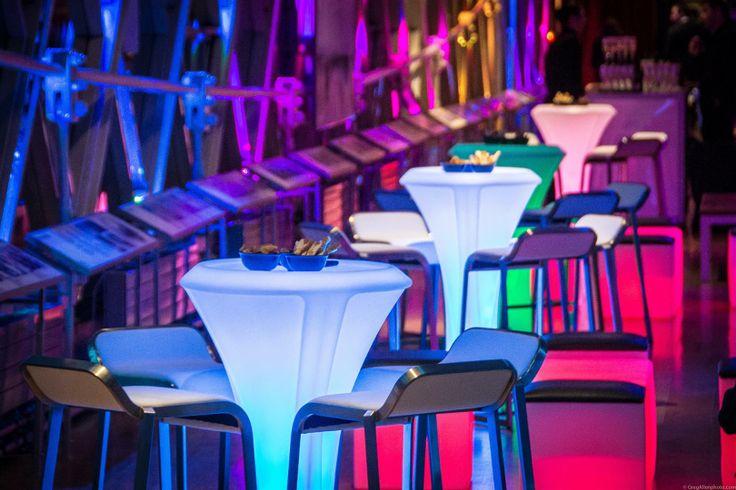 Illuminated cocktail tables in Tower Bridge event space for networking receptions.