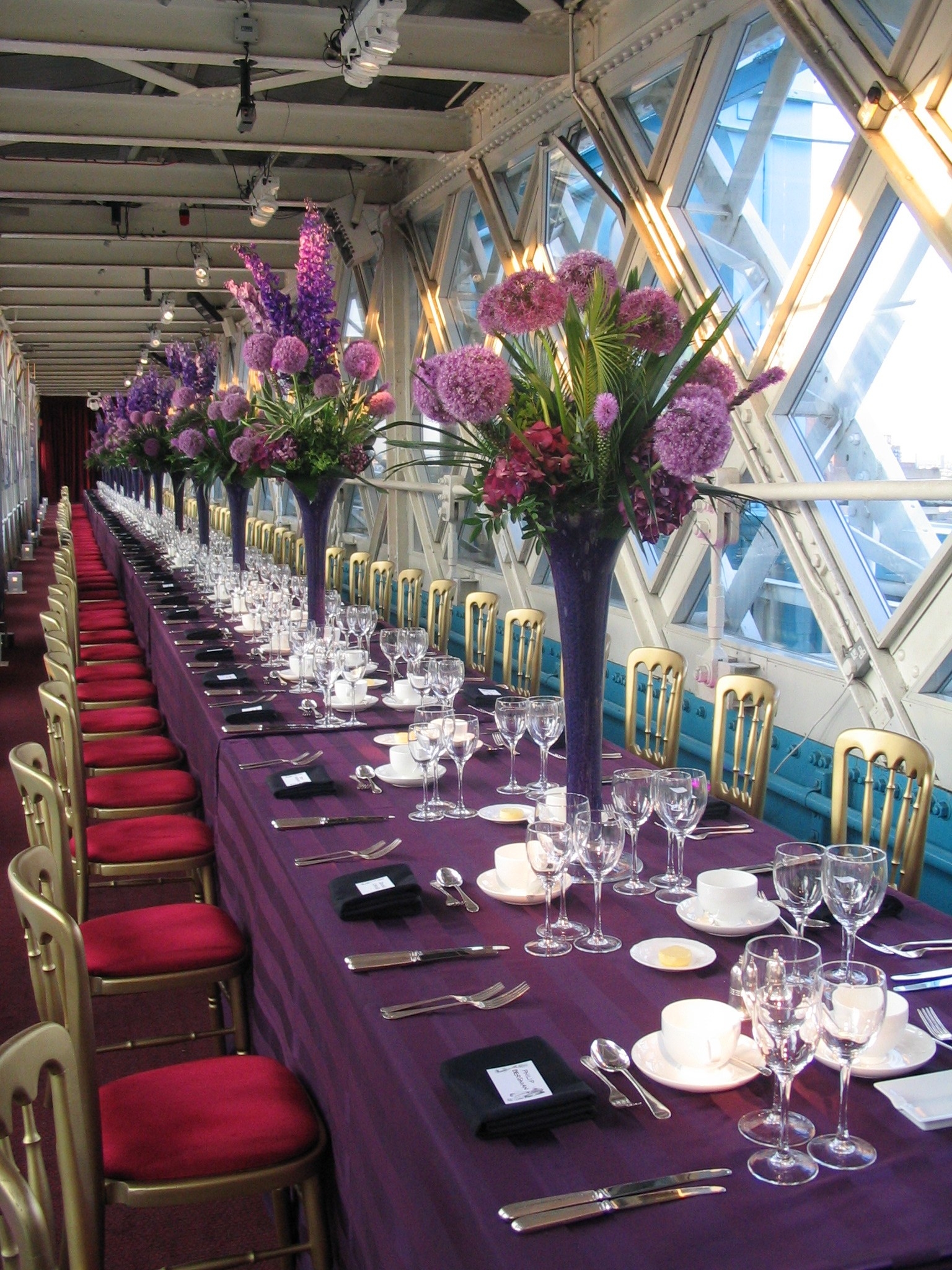 Elegant banquet table with floral centerpieces for a gala or corporate dinner at Tower Bridge.