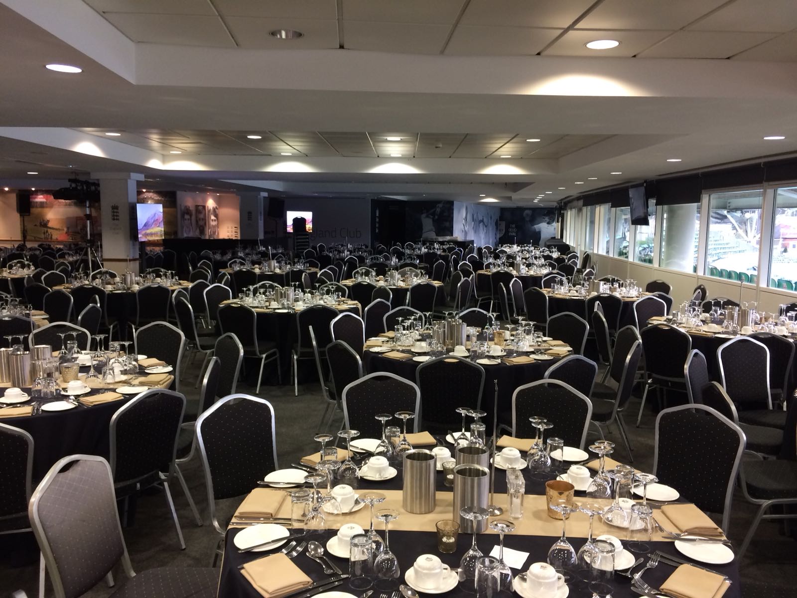 Elegant banquet setup in England Room, Kia Oval for conferences and formal dinners.