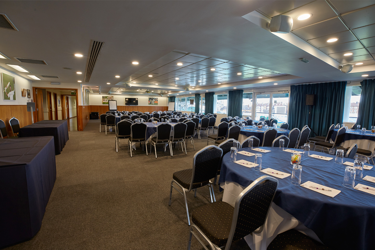 India Room at Kia Oval: bright event space with round tables for meetings and conferences.