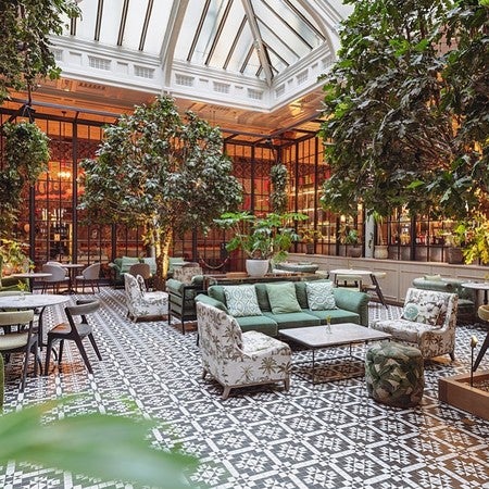 Winter Garden at Kimpton Clocktower Hotel, elegant event space with lush greenery.