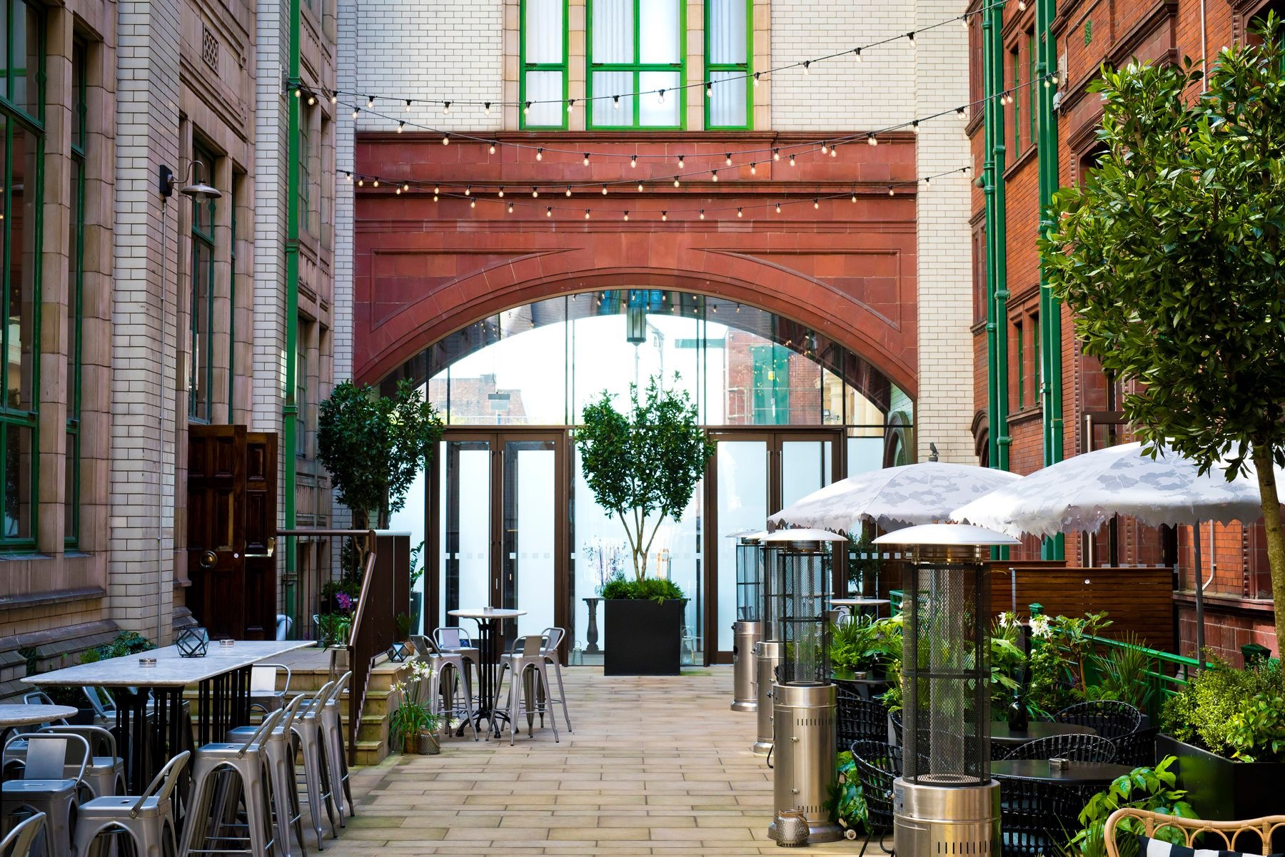 Winter Garden urban courtyard with cafe lighting for networking events and corporate receptions.