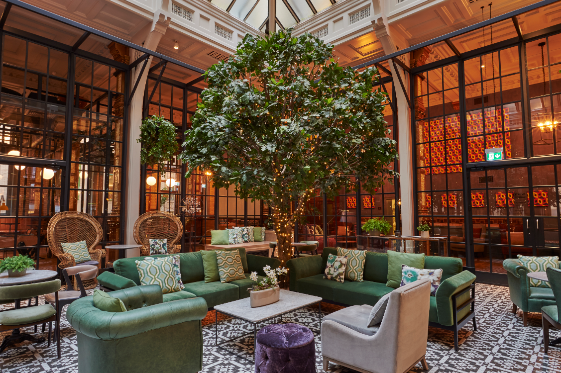 Winter Garden atrium with lounge seating for high-end networking and corporate breakout events.