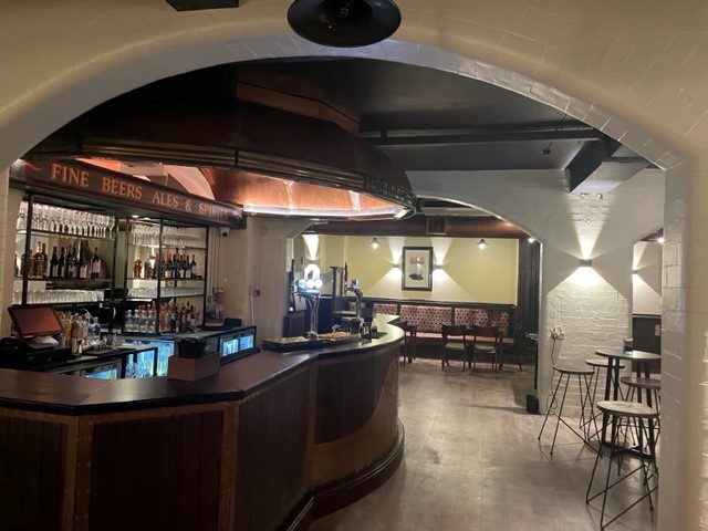 Stylish bar at The Vault, Kimpton Clocktower Hotel for intimate gatherings and networking events.