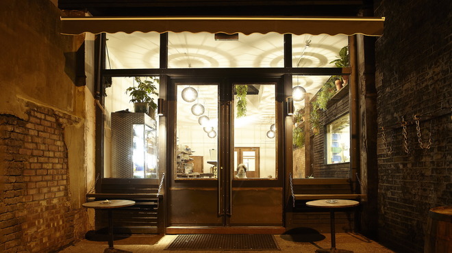 Charming Canvas Works venue entrance with plants, ideal for meetings and networking events.