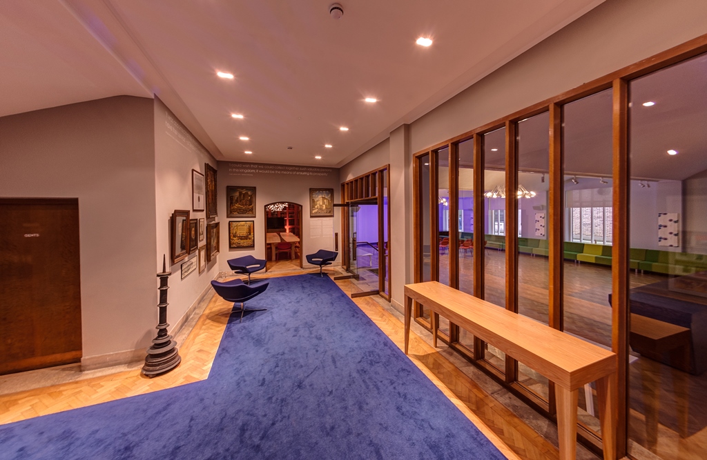 Elegant event space in The Dutch Hall with plush blue carpet, ideal for meetings and workshops.