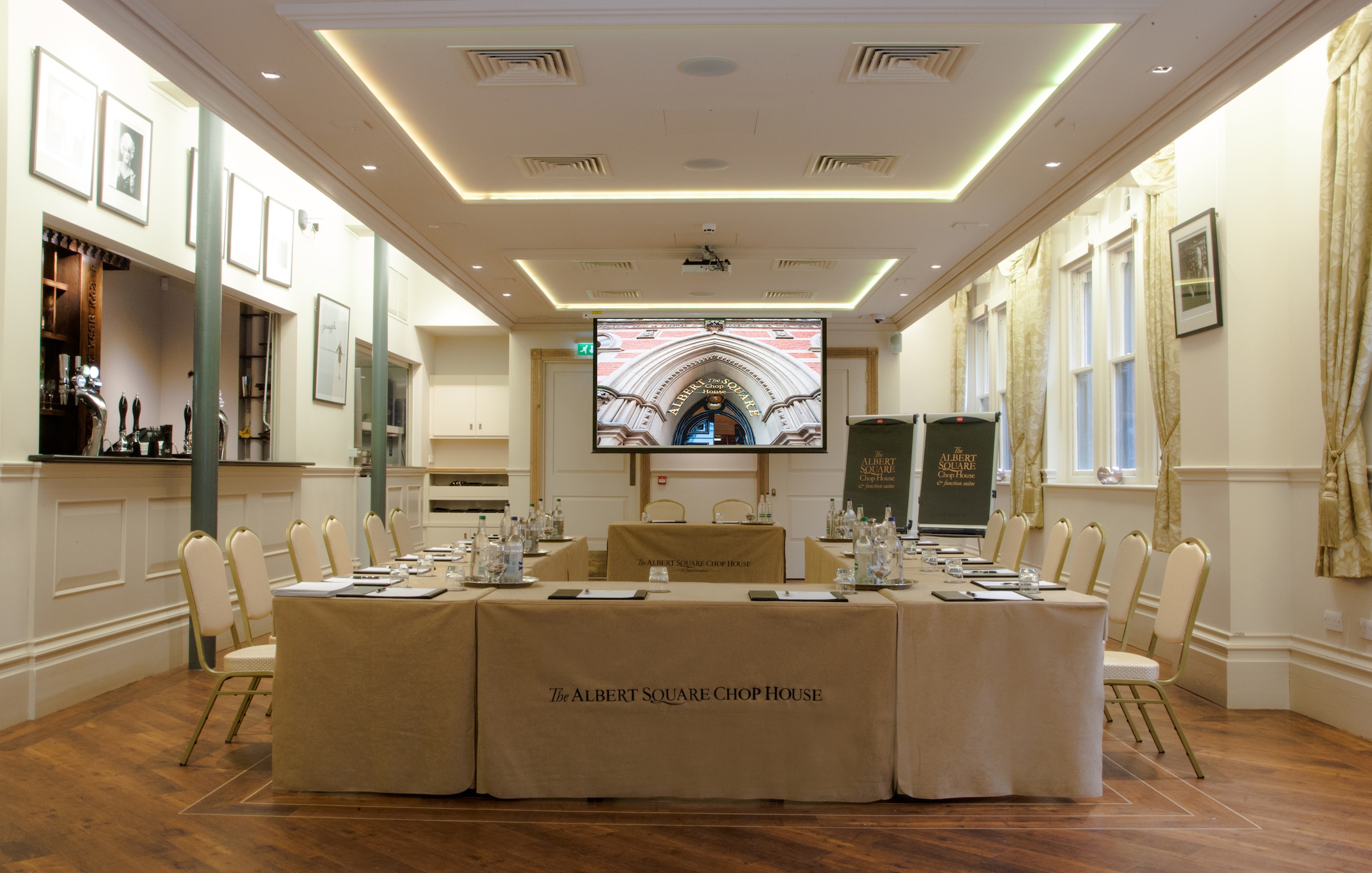 Memorial Hall meeting room with central table, ideal for corporate events and presentations.