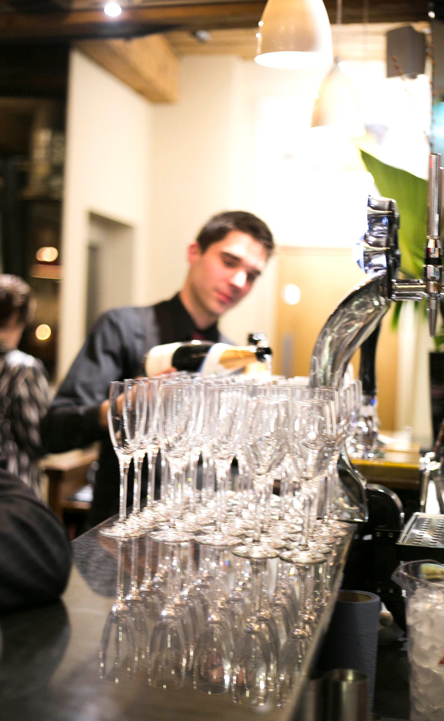 Bartender pouring wine at The Restaurant, Fountain House, perfect for networking events.
