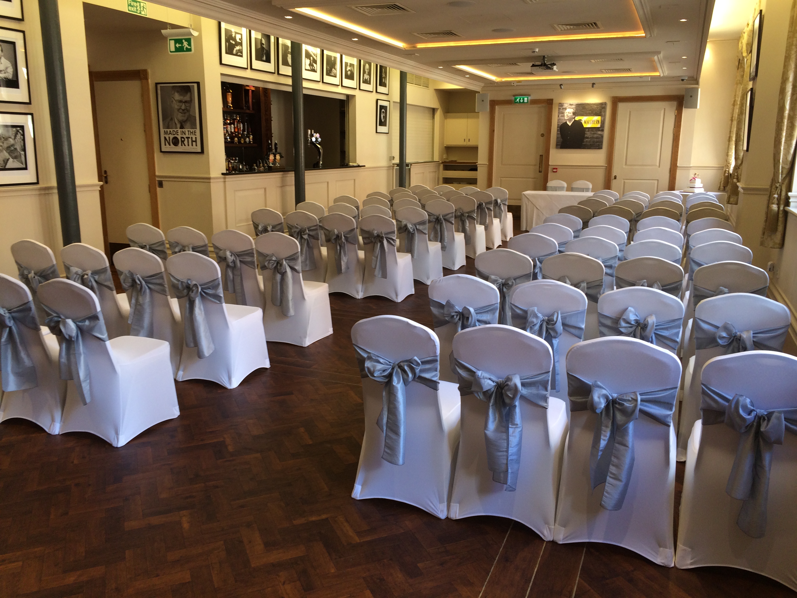 Formal event space at The Restaurant, Fountain House with elegant silver-sashed chairs.