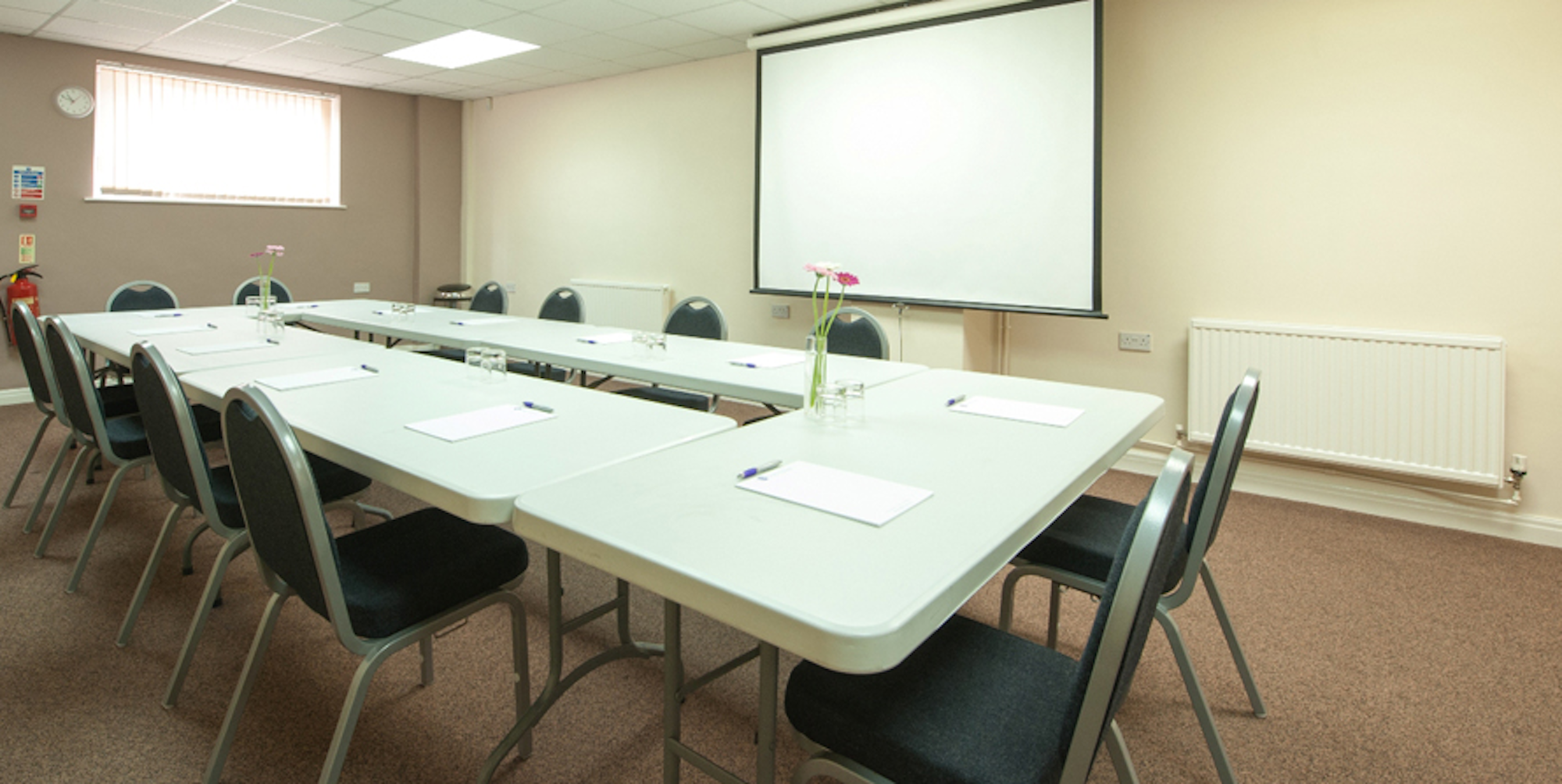 Seminar Room 4 at King's House, organized for professional meetings with natural light.