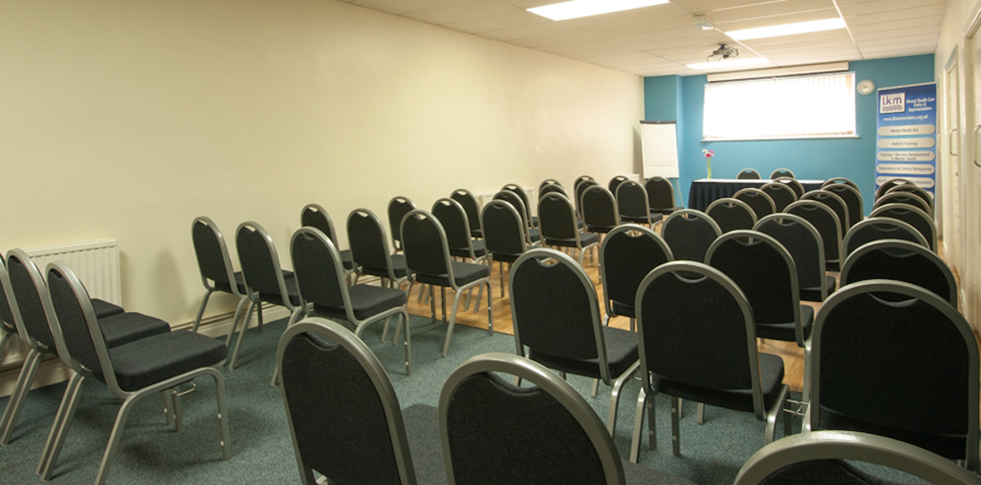 Seminar Room 5 at King's House: organized meeting space for workshops and presentations.