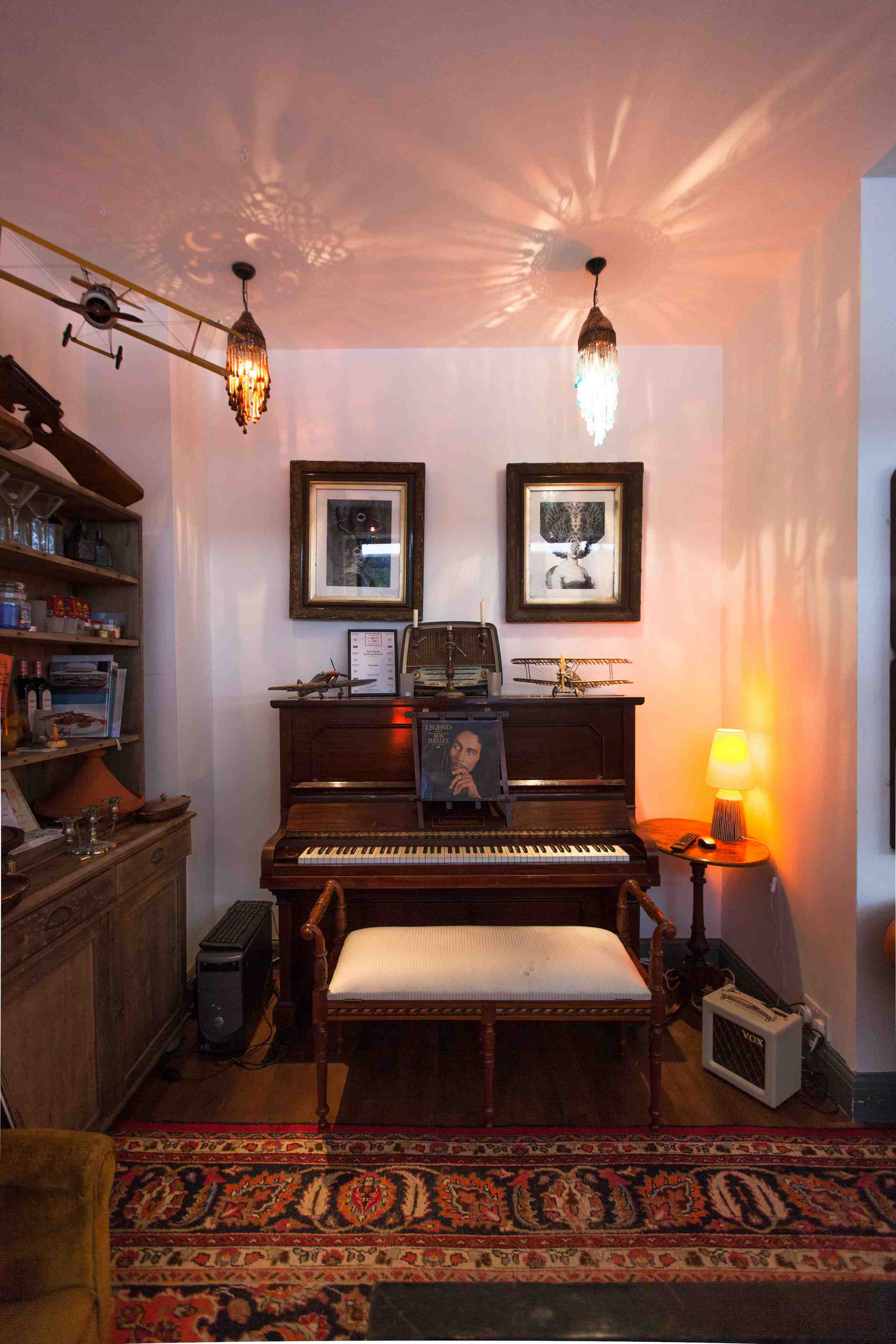 Charming Kitchen and Lounge with antique piano, perfect for networking events.