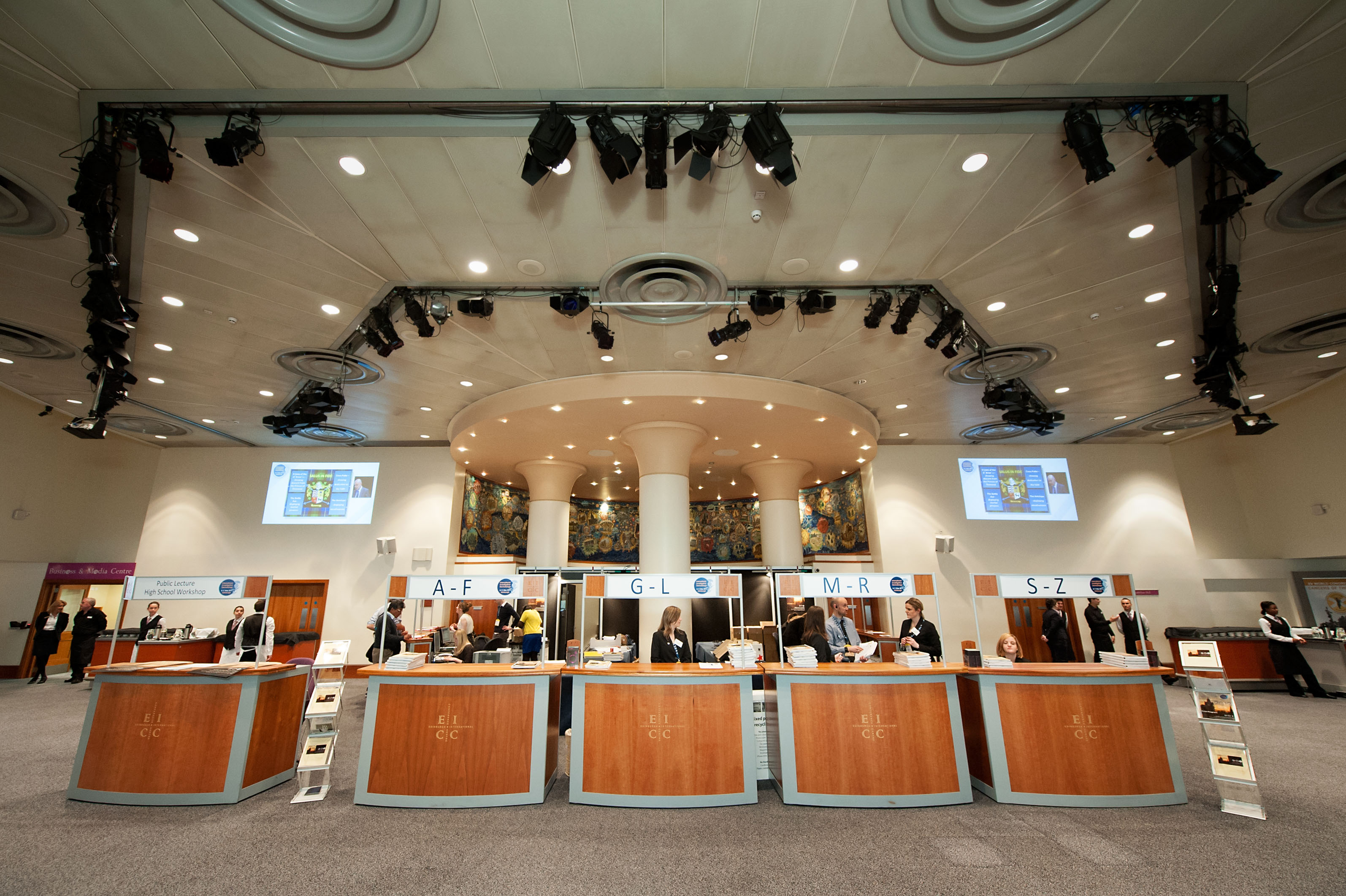 Strathblane Hall registration area with check-in counters for a conference event.