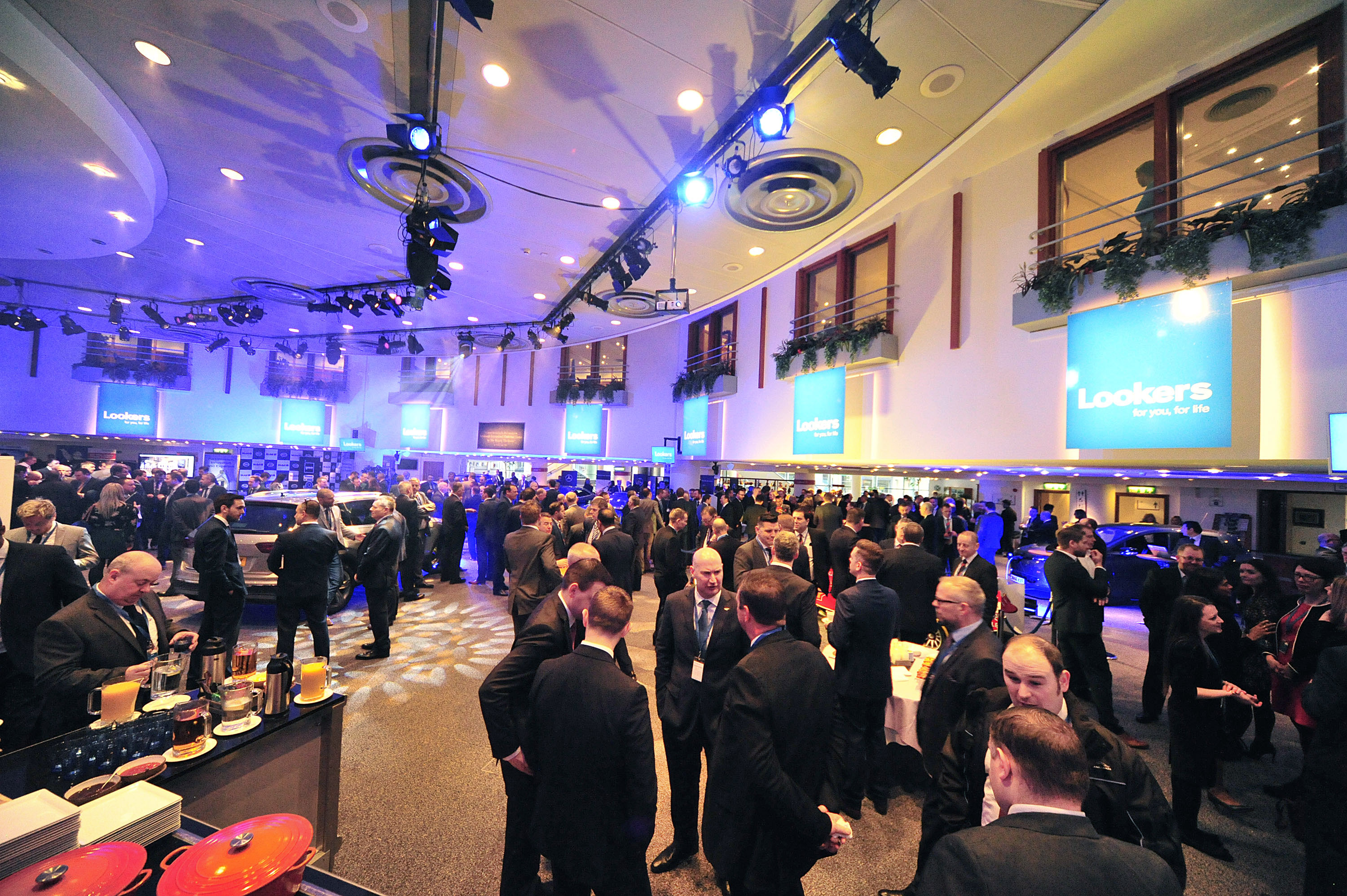 Strathblane Hall at Edinburgh Conference Centre, bustling networking event with ambient lighting.