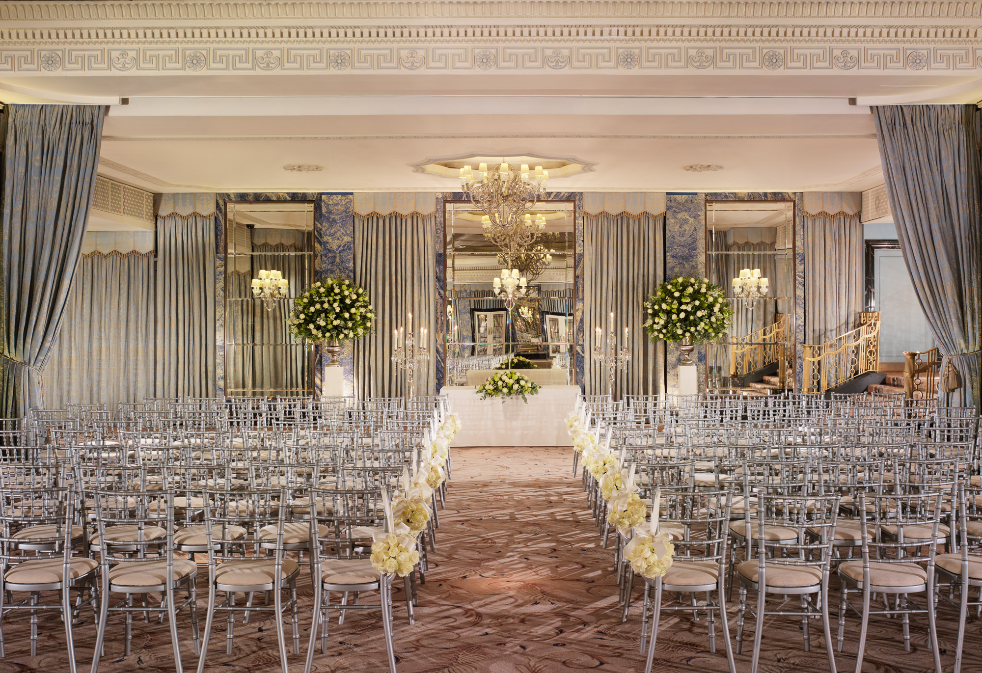 Elegant ballroom at The Dorchester with chandeliers, perfect for weddings and formal events.