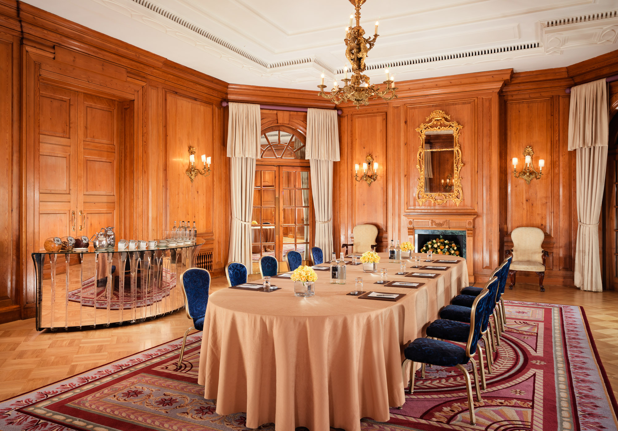 Sophisticated meeting room at The Dorchester with elegant wood paneling, ideal for events.