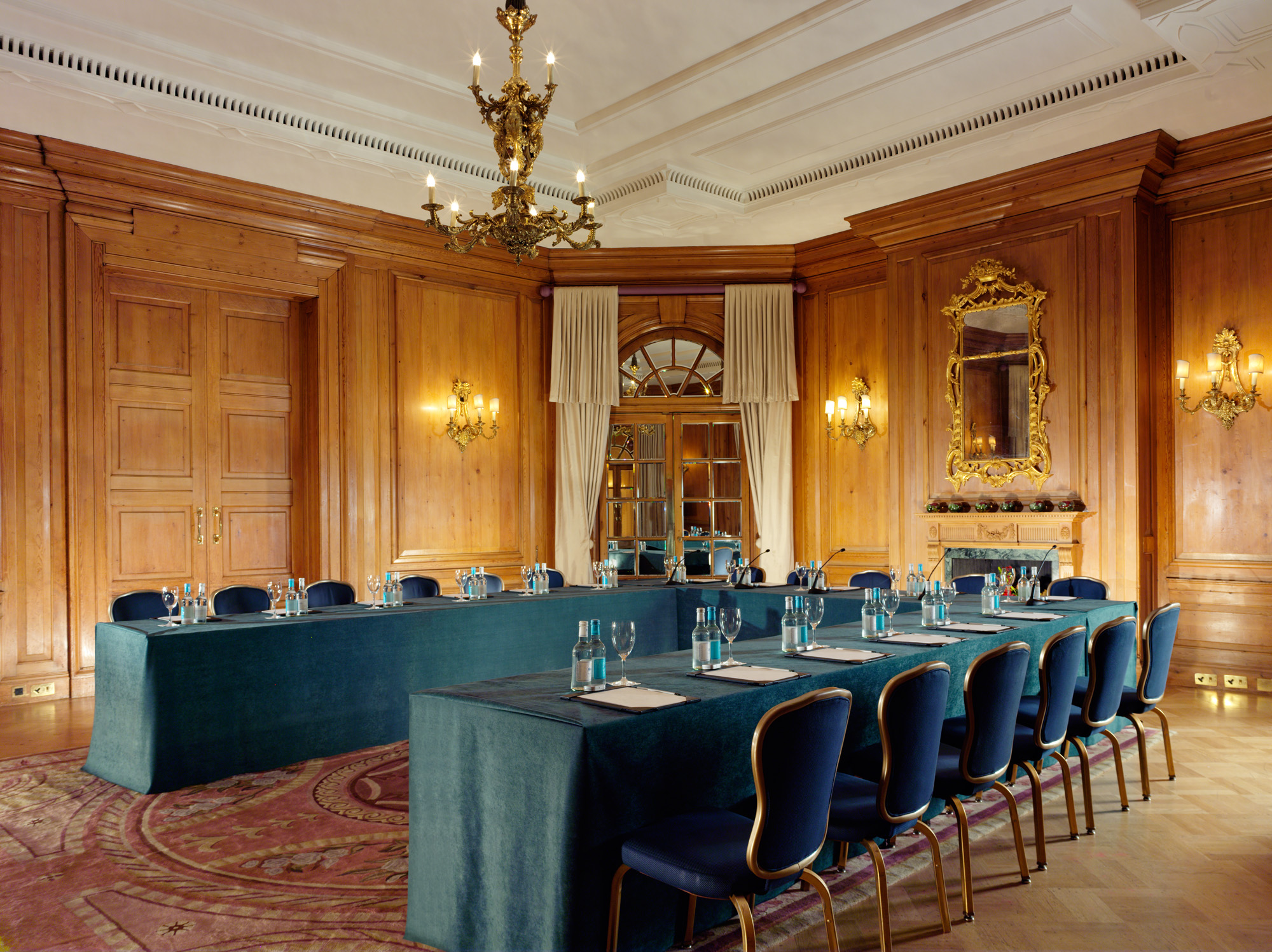 Sophisticated meeting room at The Dorchester with elegant chandeliers for corporate events.