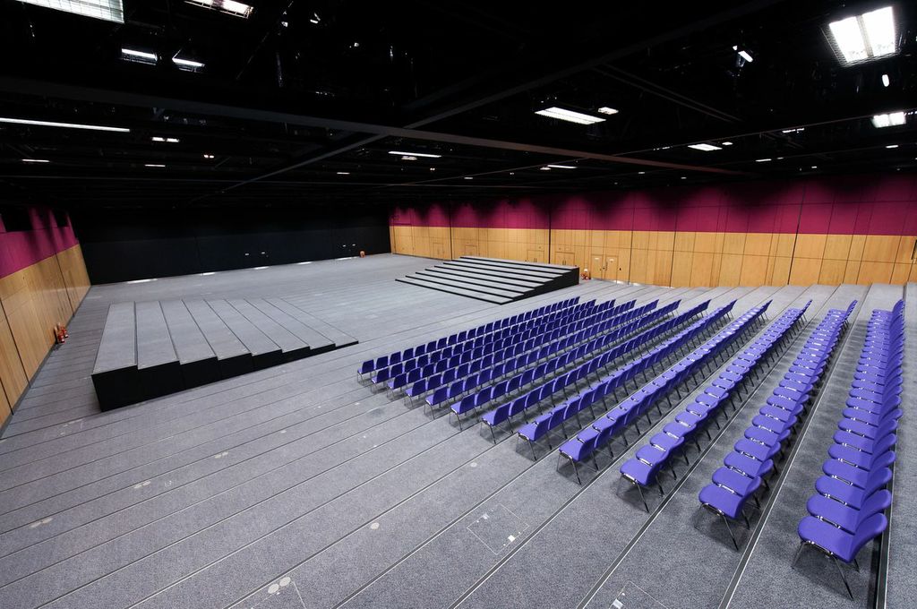 Lennox Suite at Edinburgh Conference Centre with tiered stage, ideal for conferences.