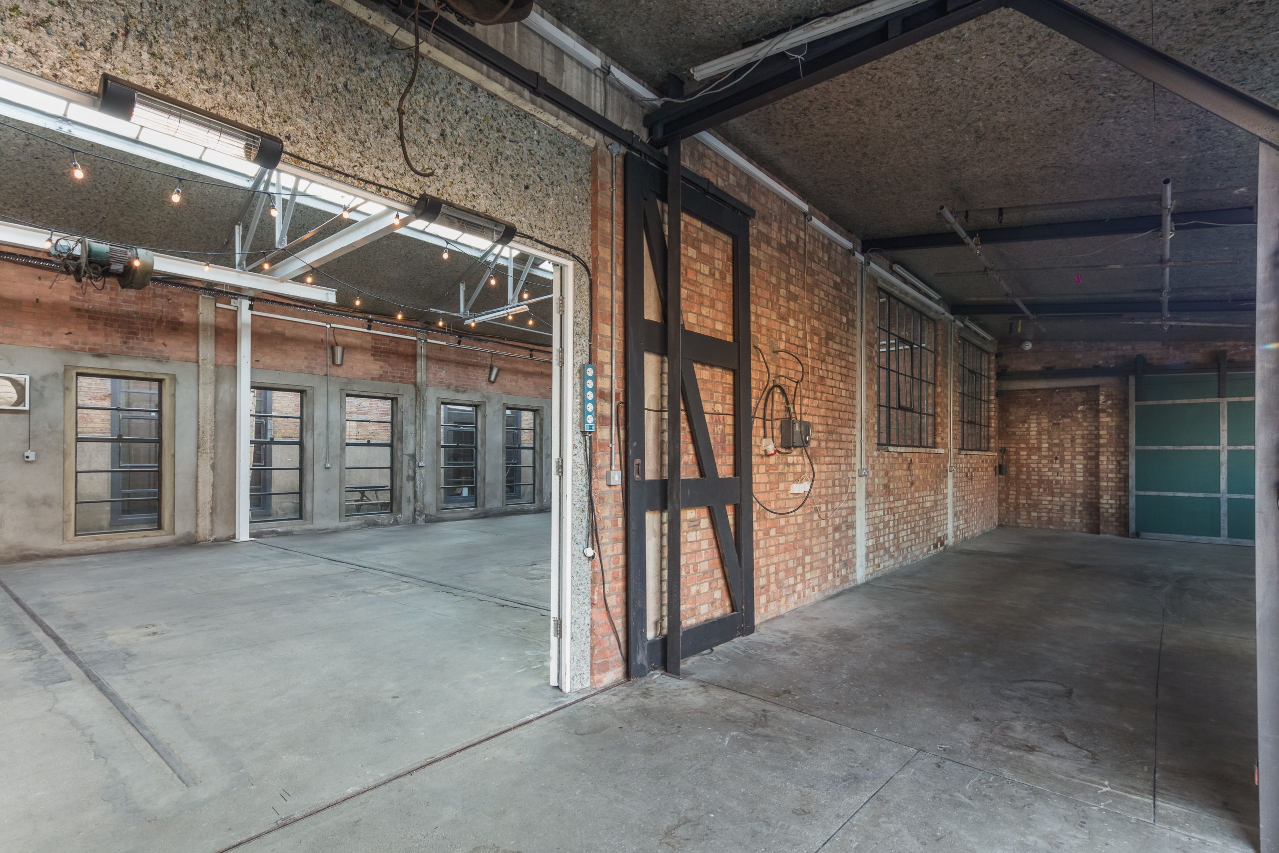 Atrium at Hoxton Docks: versatile industrial event space with exposed brick and natural light.
