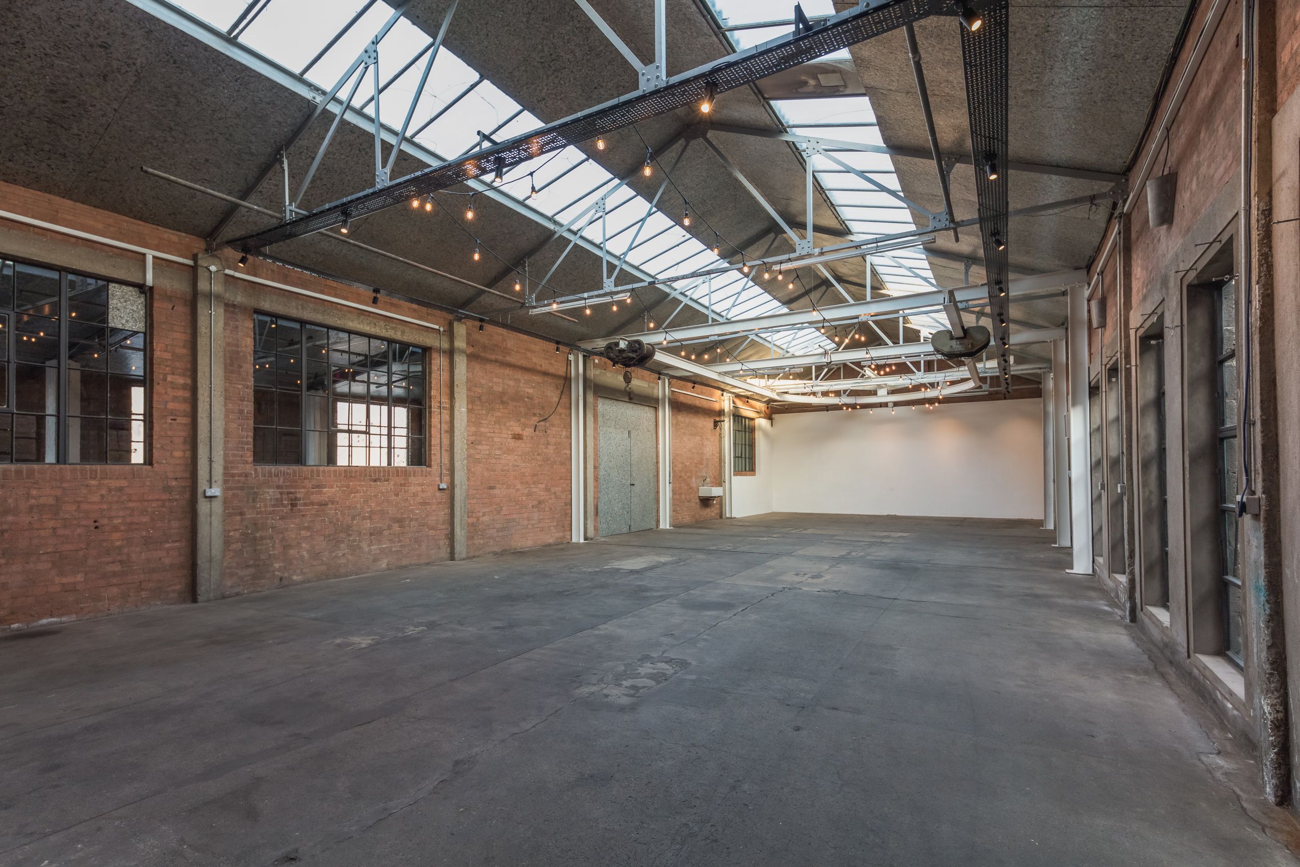 Atrium in Hoxton Docks: spacious industrial venue with exposed brick for events.