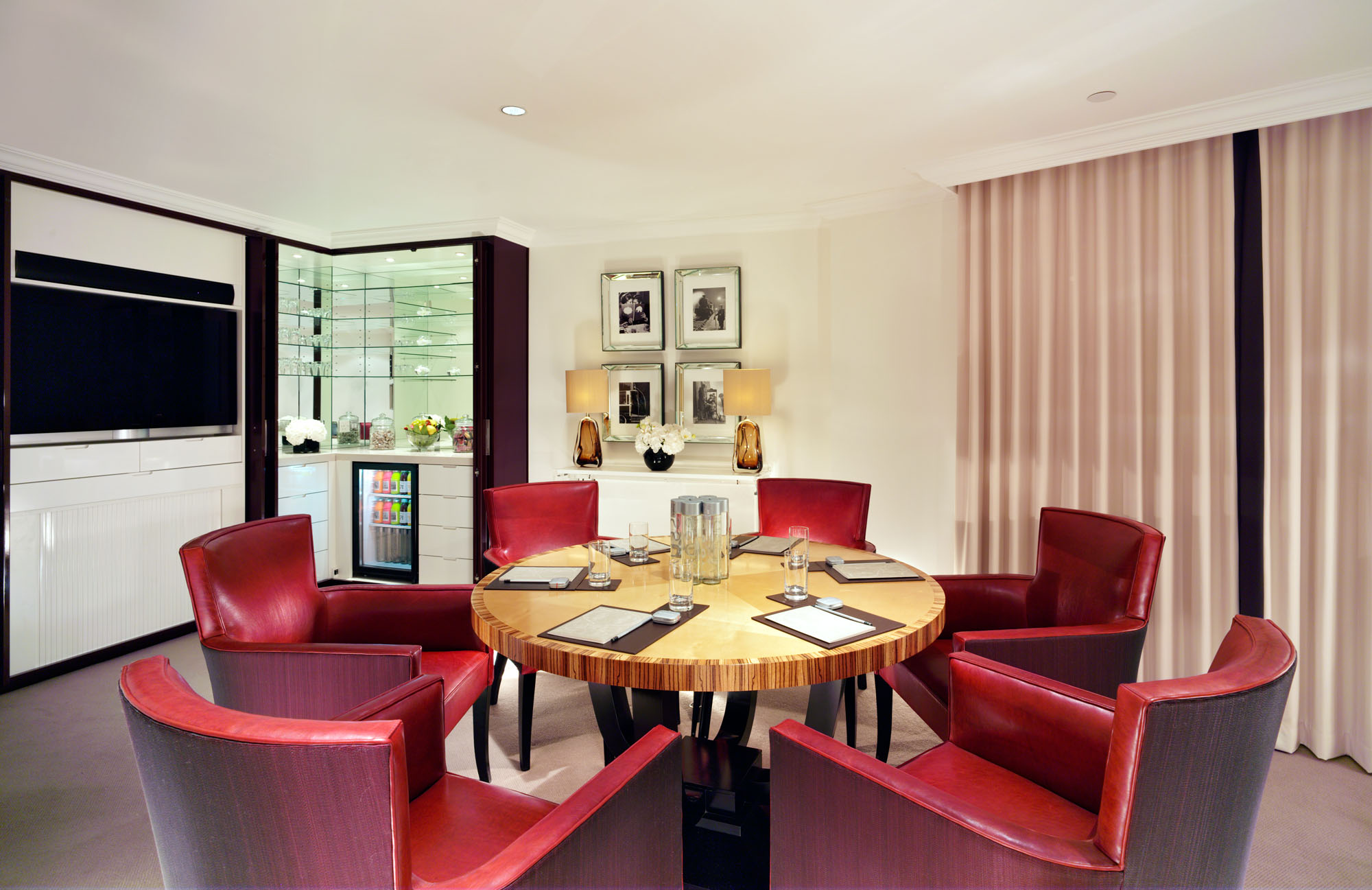 Elegant meeting room at The Dorchester with round table, ideal for intimate events.
