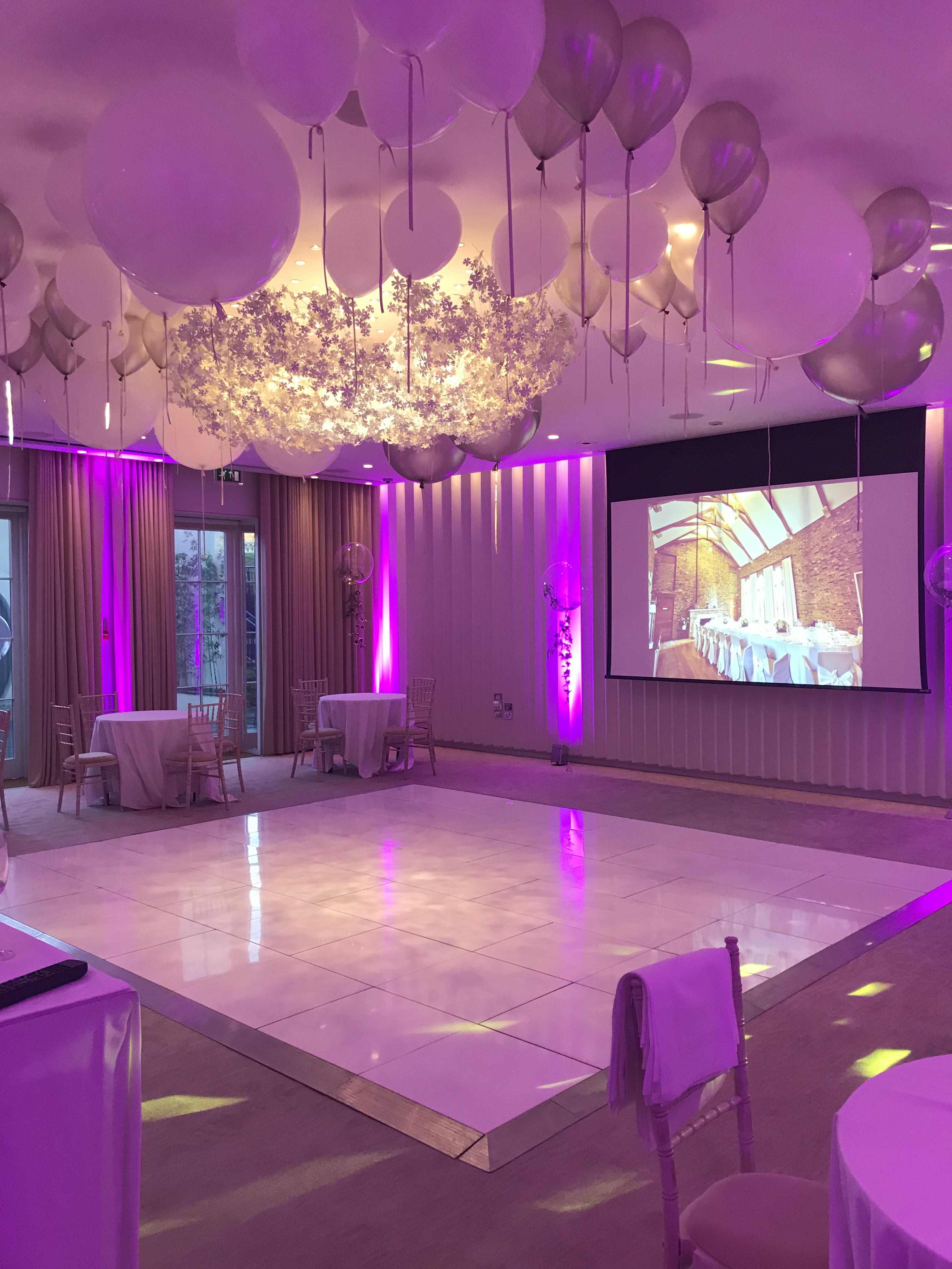 Elegant event space in Coworth Park with purple lighting, perfect for weddings and corporate events.