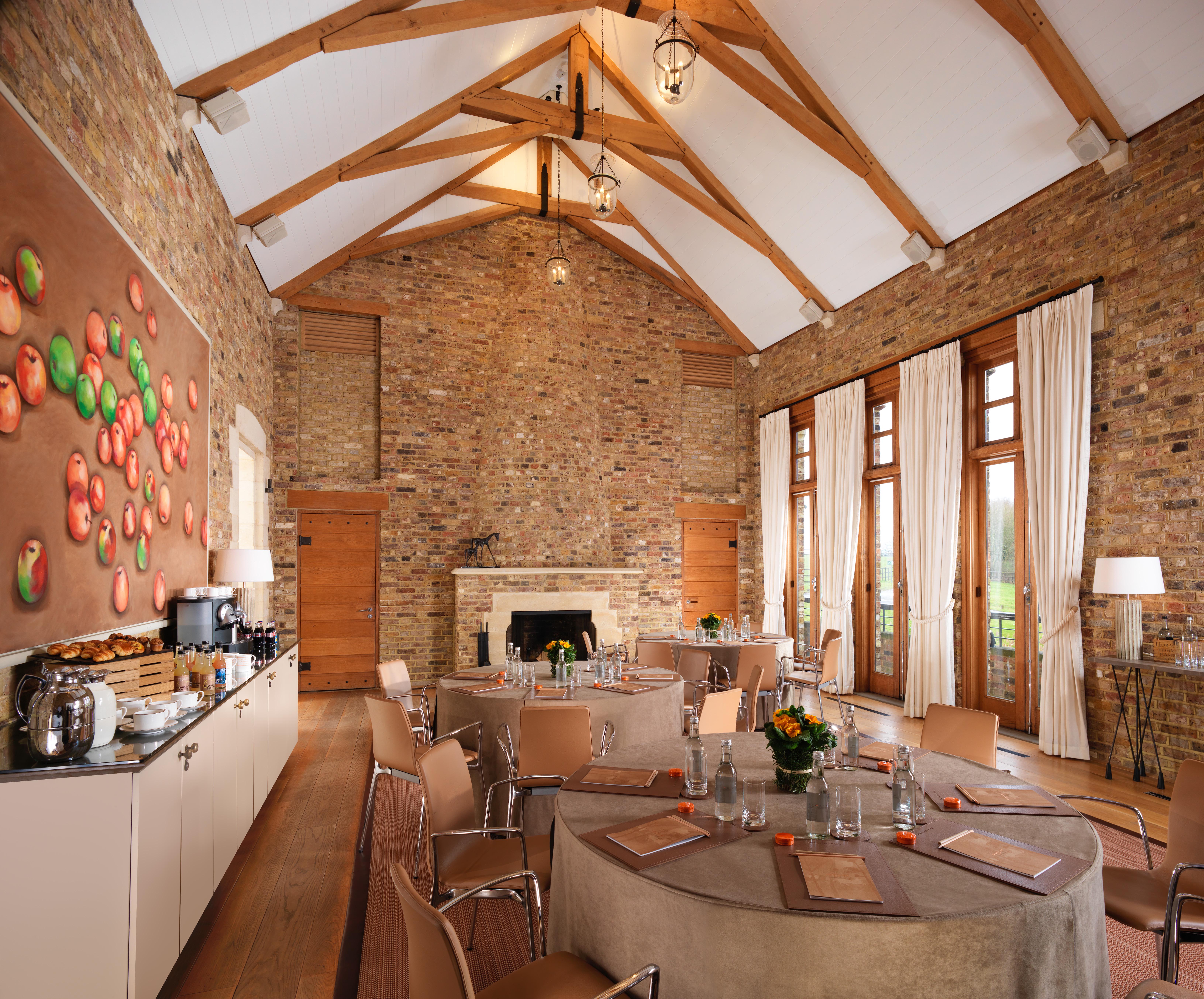 The Tower House meeting space with rustic beams, ideal for workshops and gatherings.