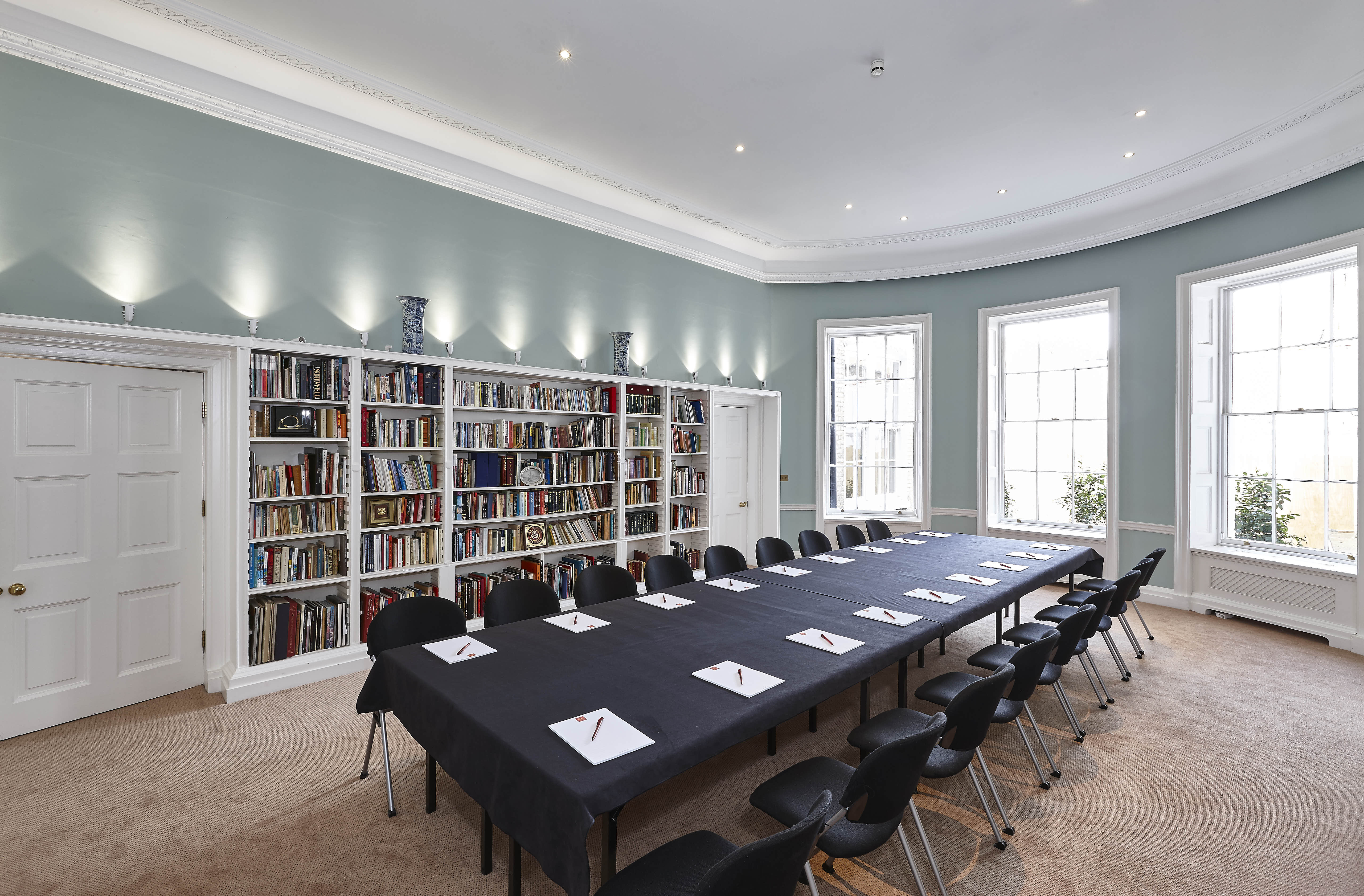 Library meeting room in Asia House with natural light, ideal for corporate workshops.