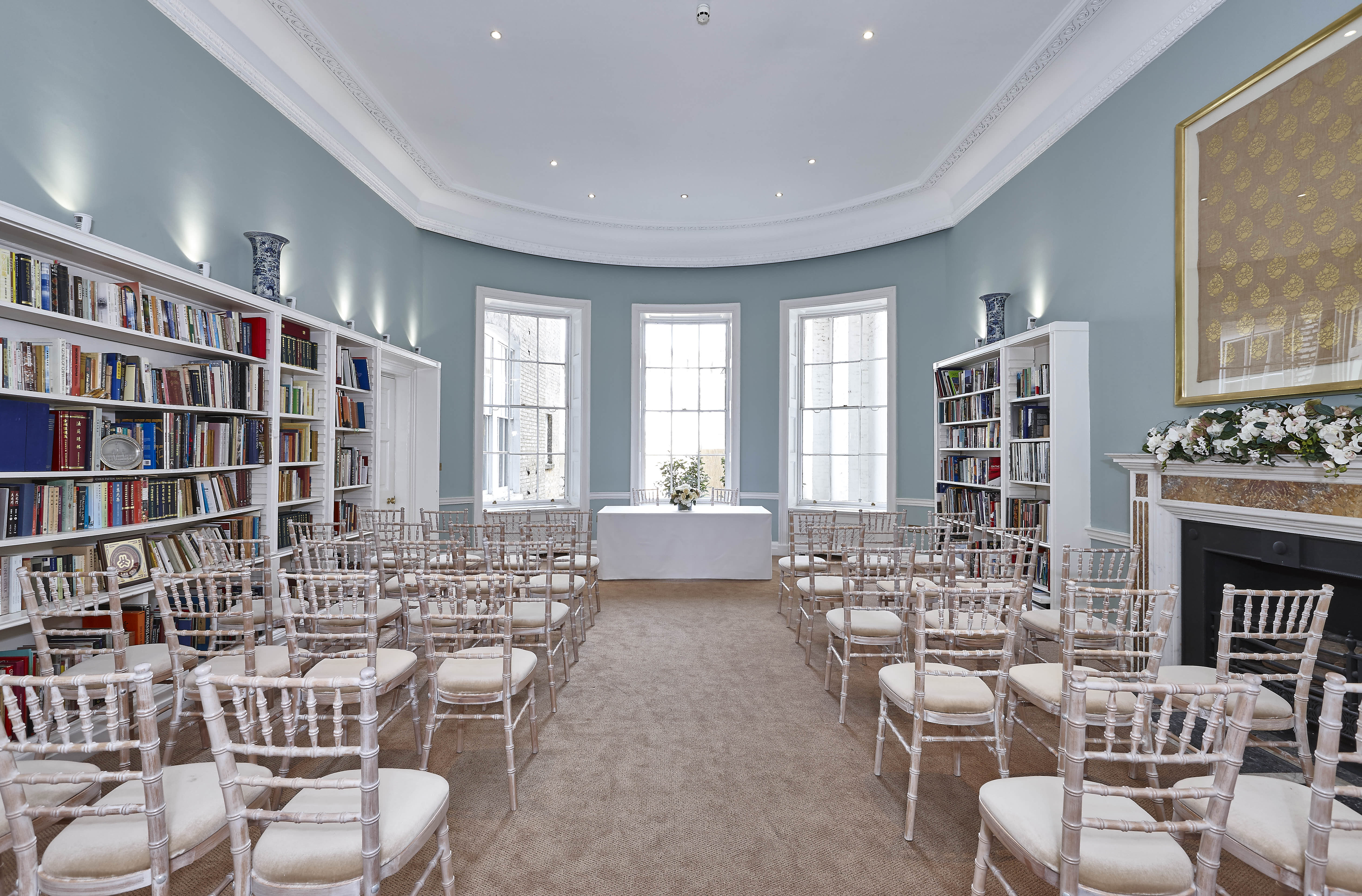 Library meeting space with chiavari chairs, perfect for workshops and small conferences.